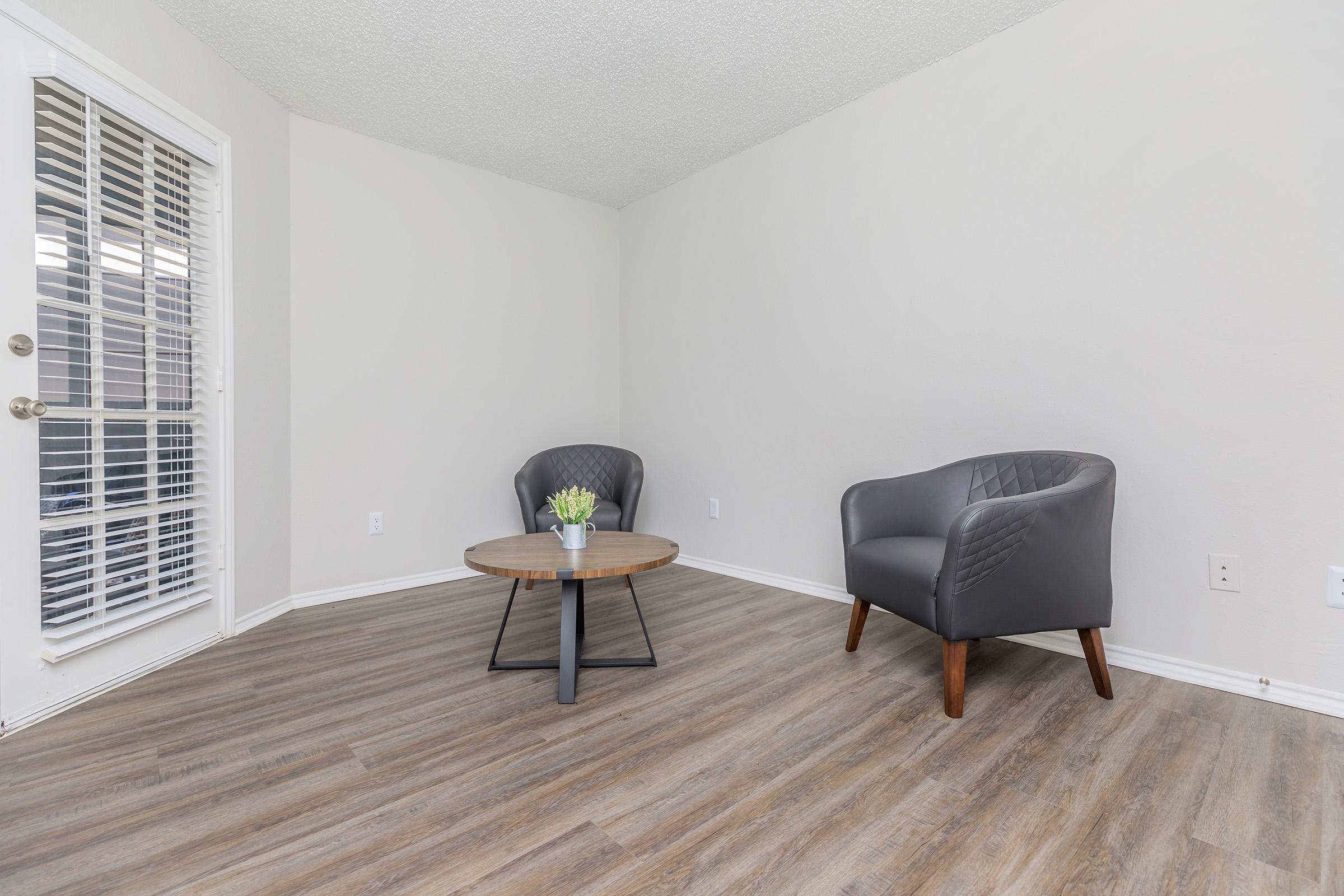 a living room with a wood floor