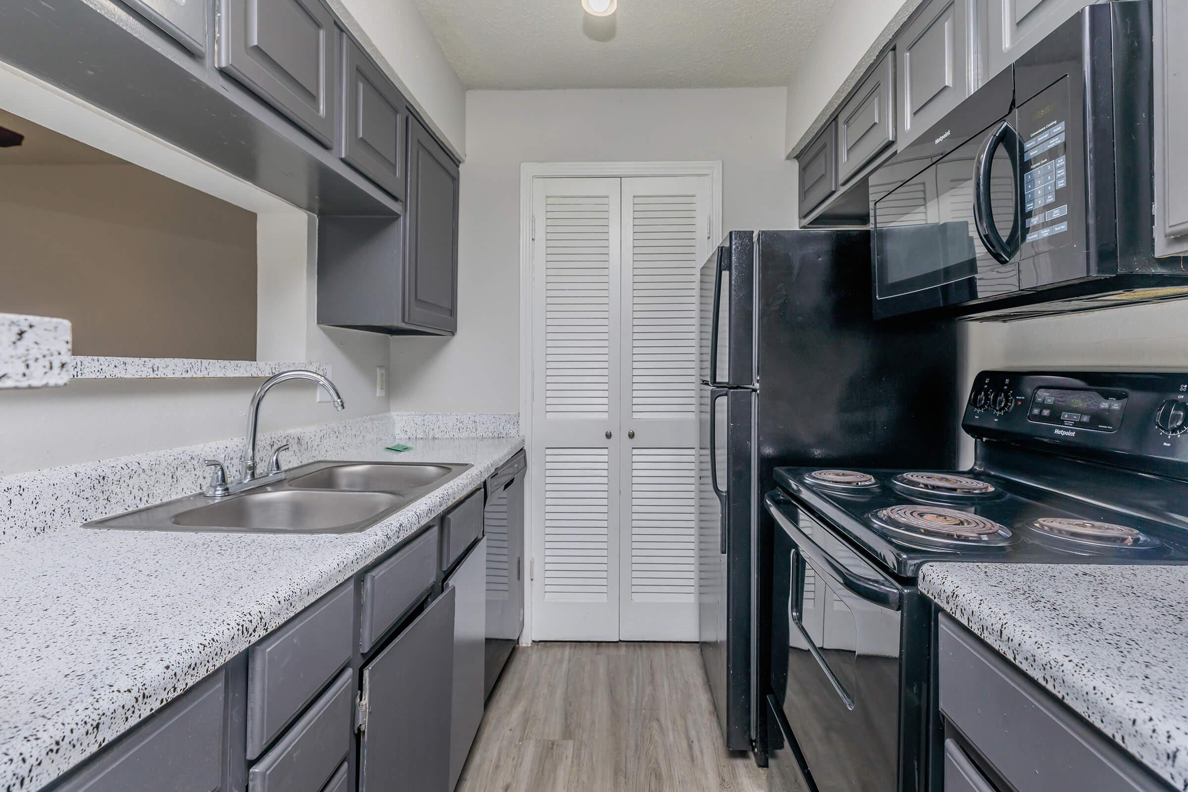 a kitchen with a sink and a window