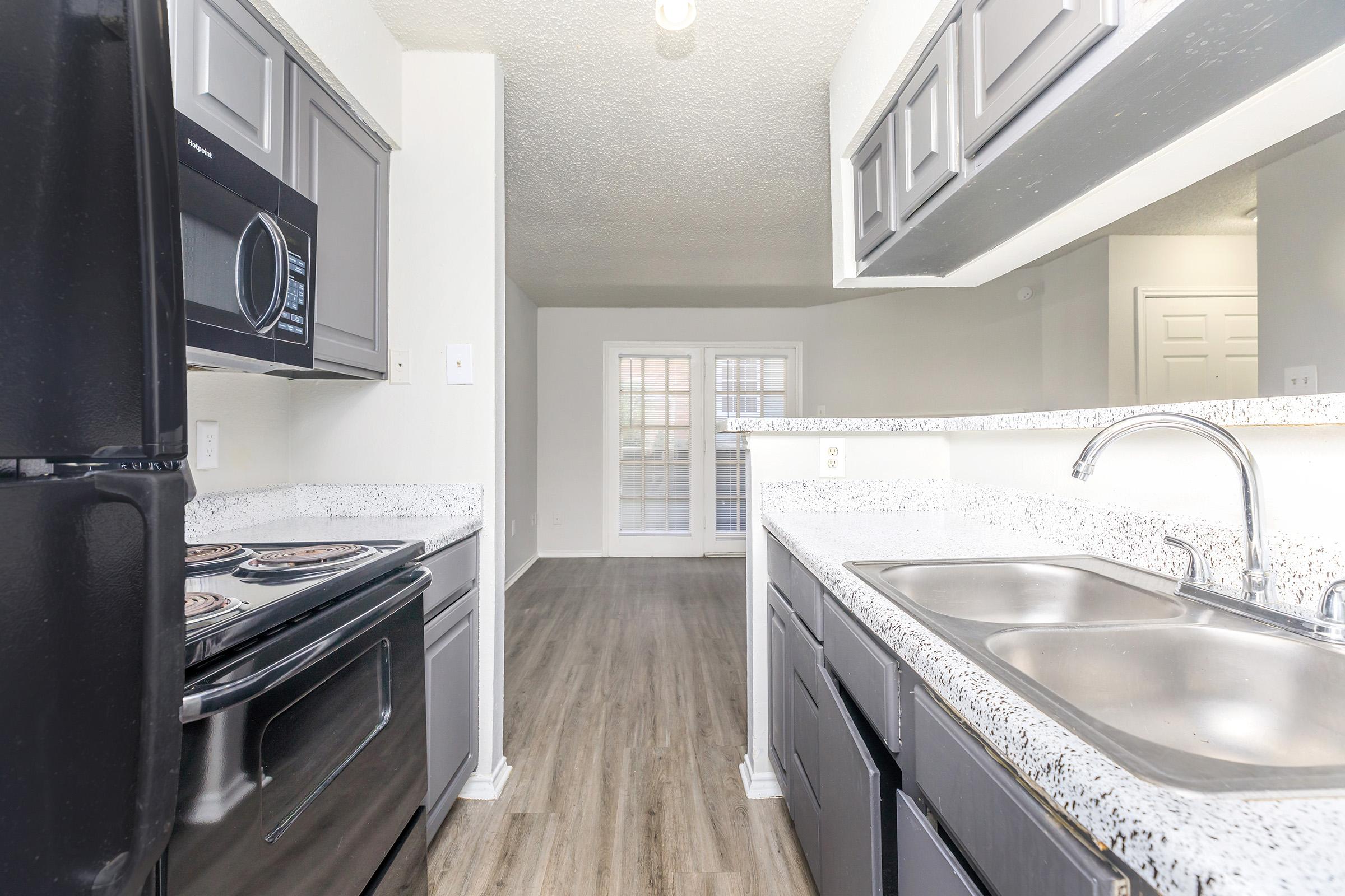 a kitchen with a sink and a window