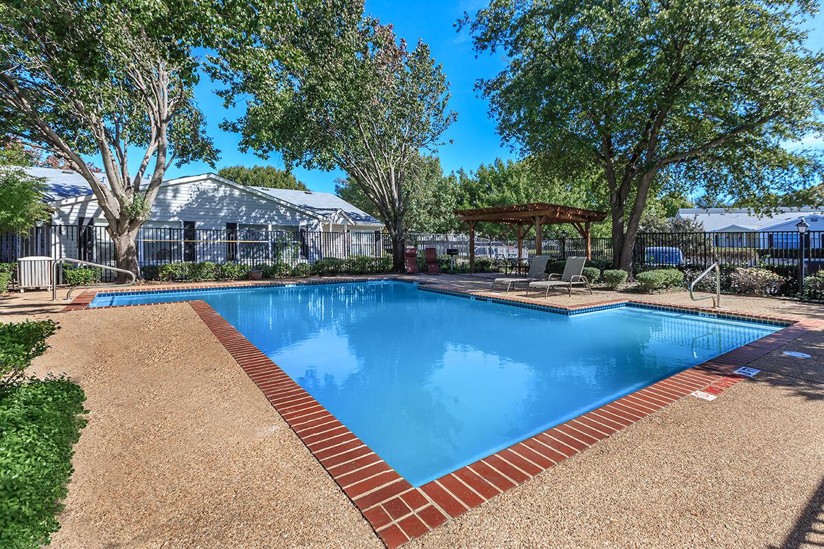 a pool next to a body of water