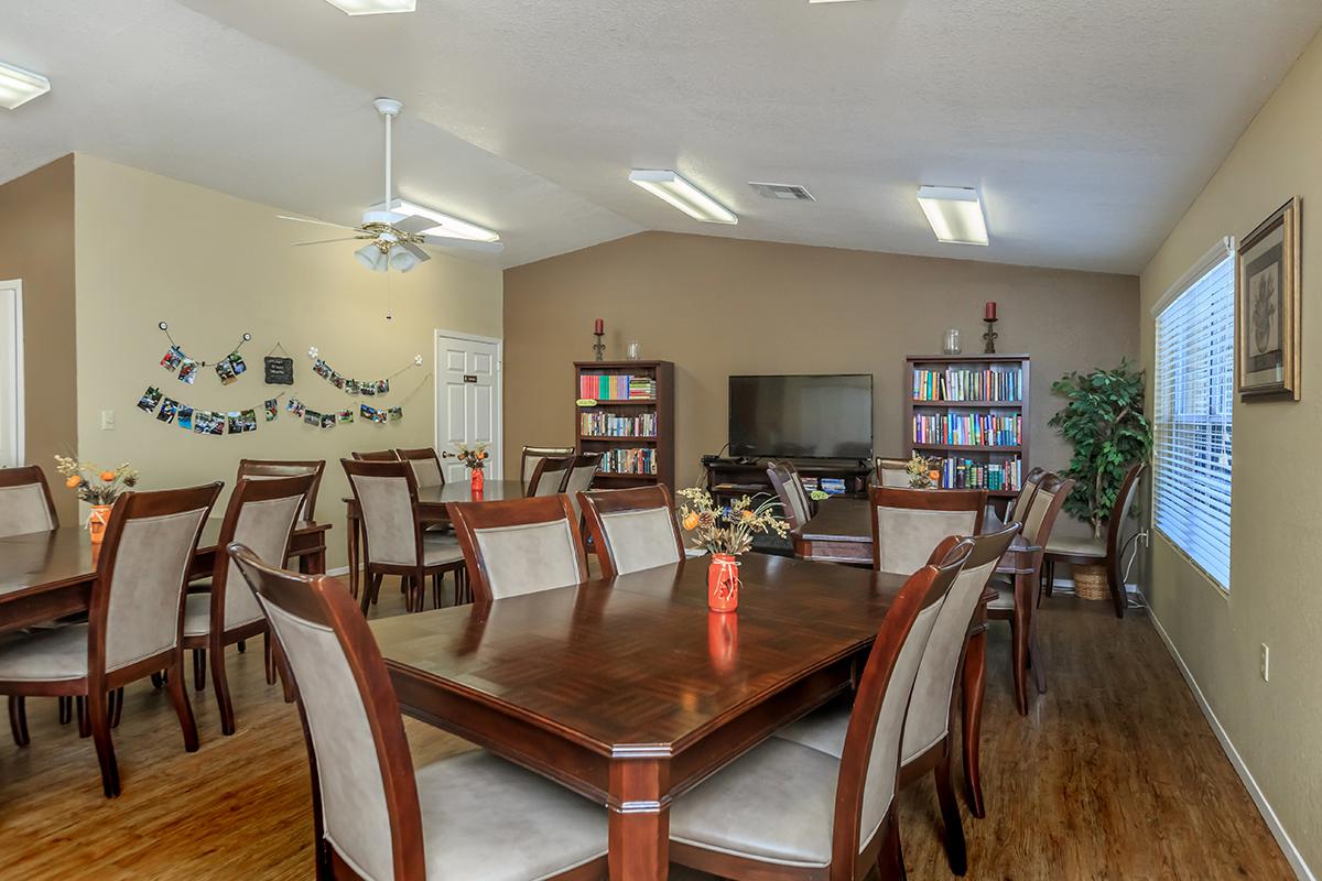a living room filled with furniture on top of a wooden table