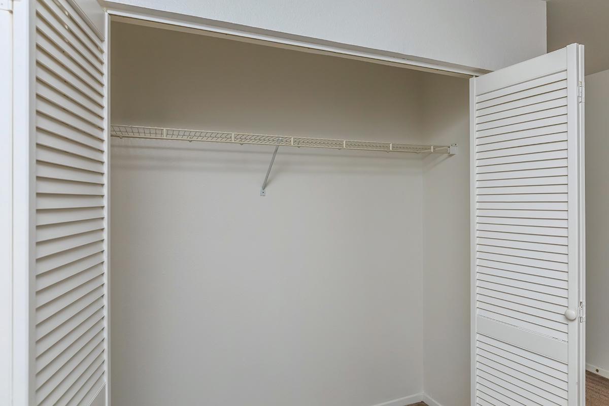 a white sink sitting under a window