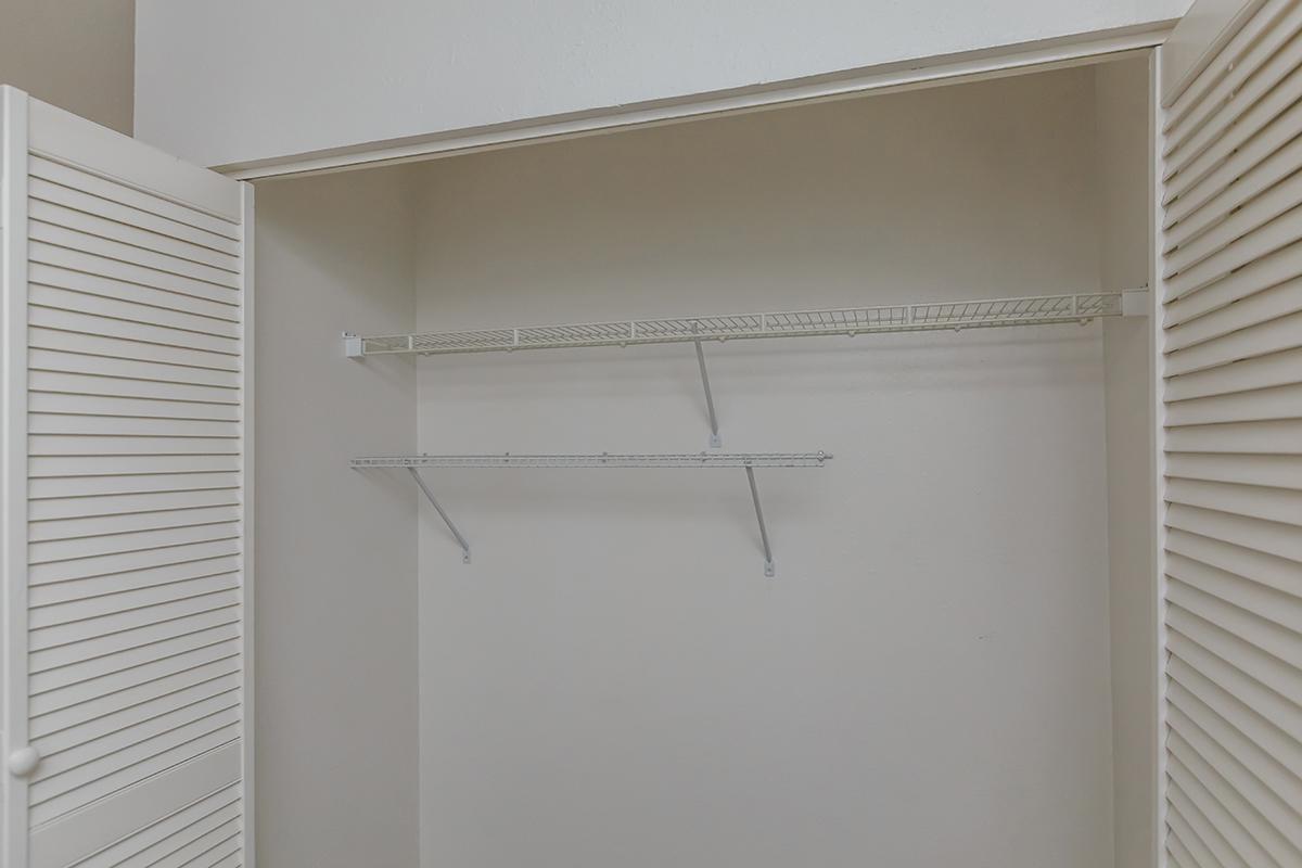 a white refrigerator freezer sitting next to a window
