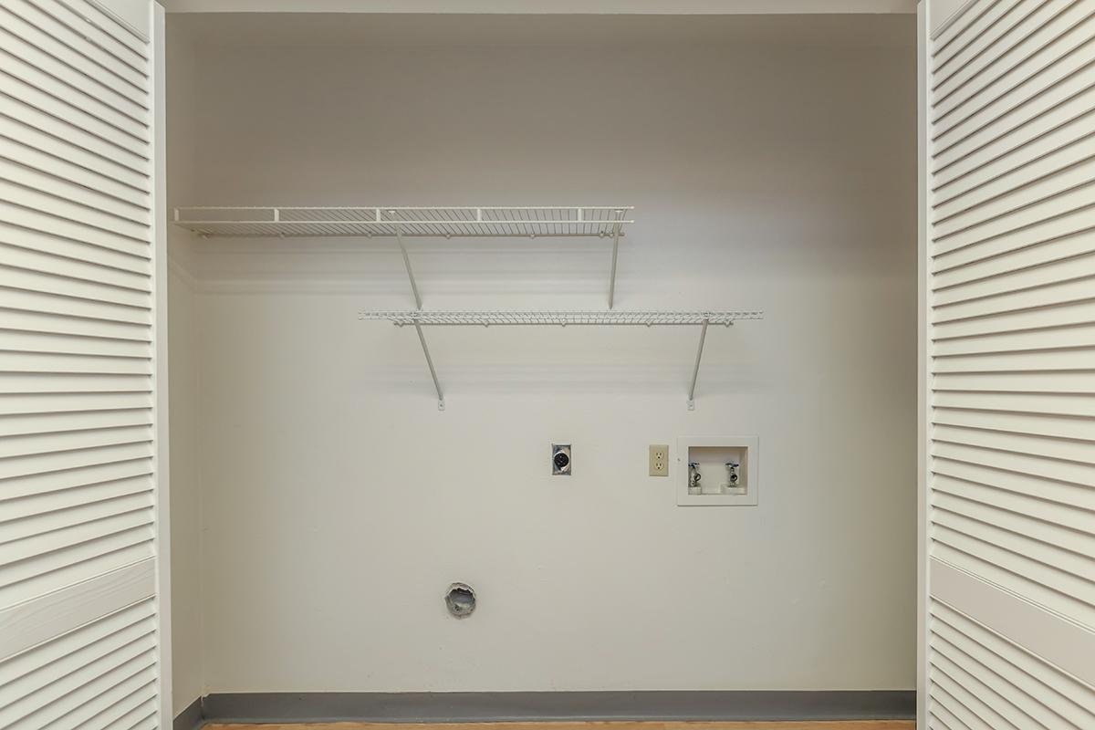 a white sink sitting under a window
