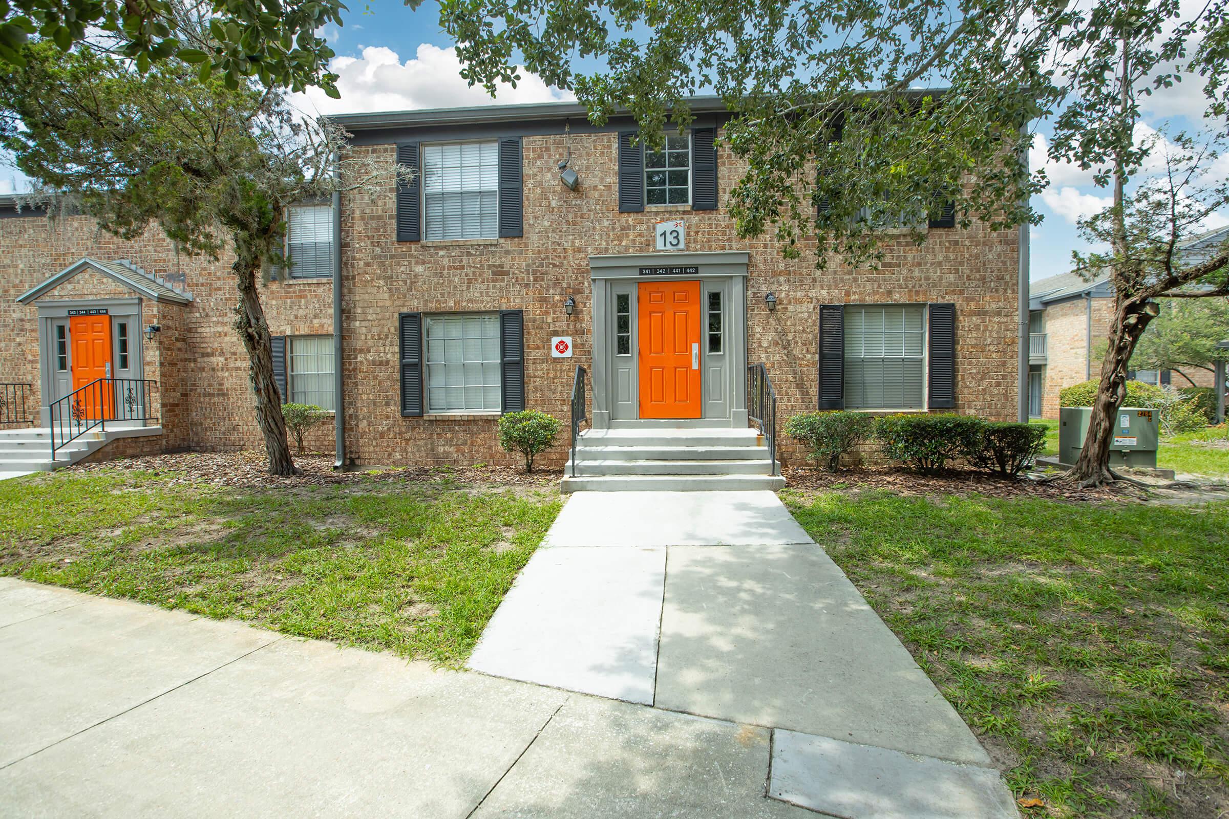 a house in the middle of a sidewalk