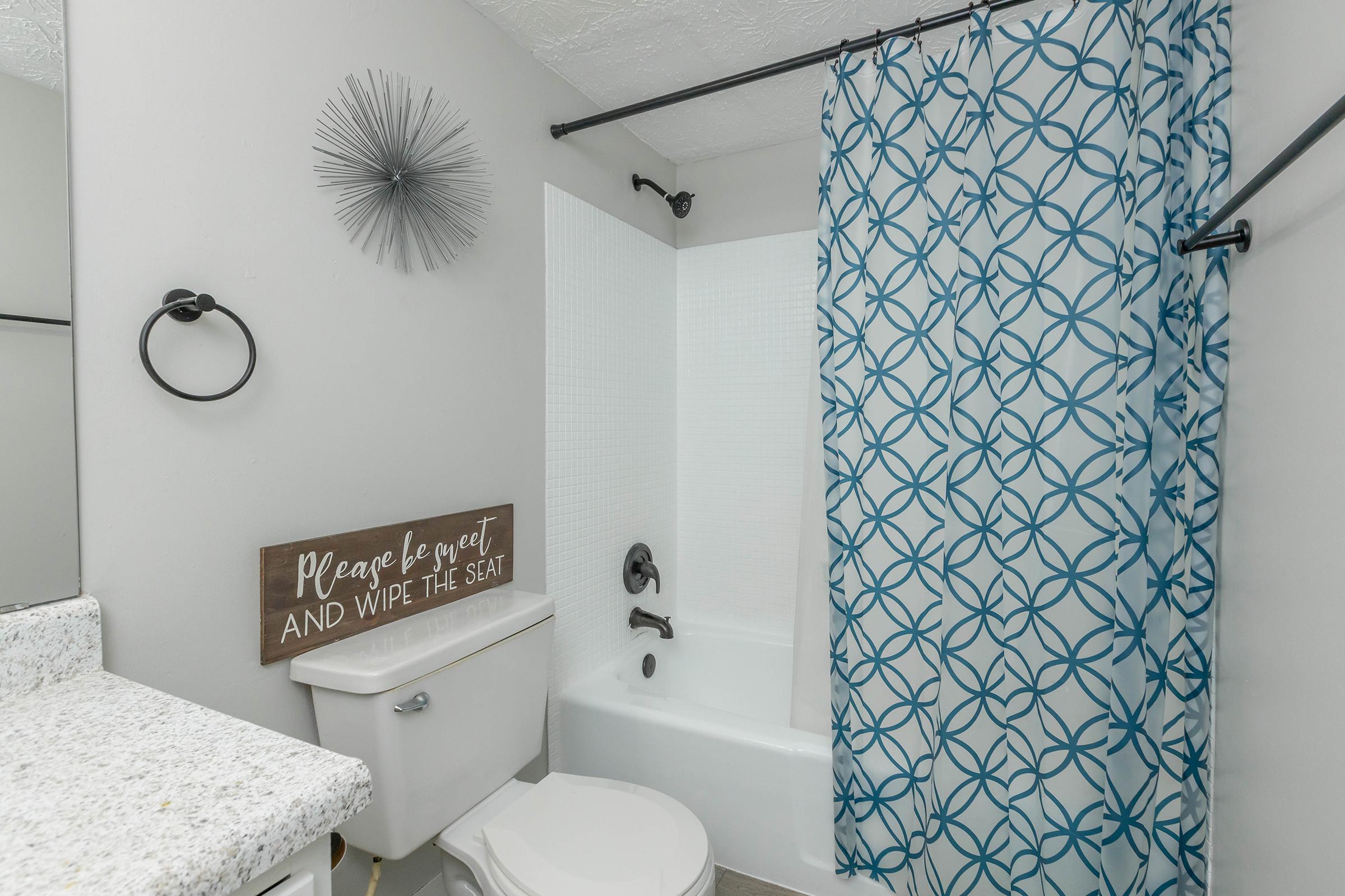 a shower that has a sink and a mirror