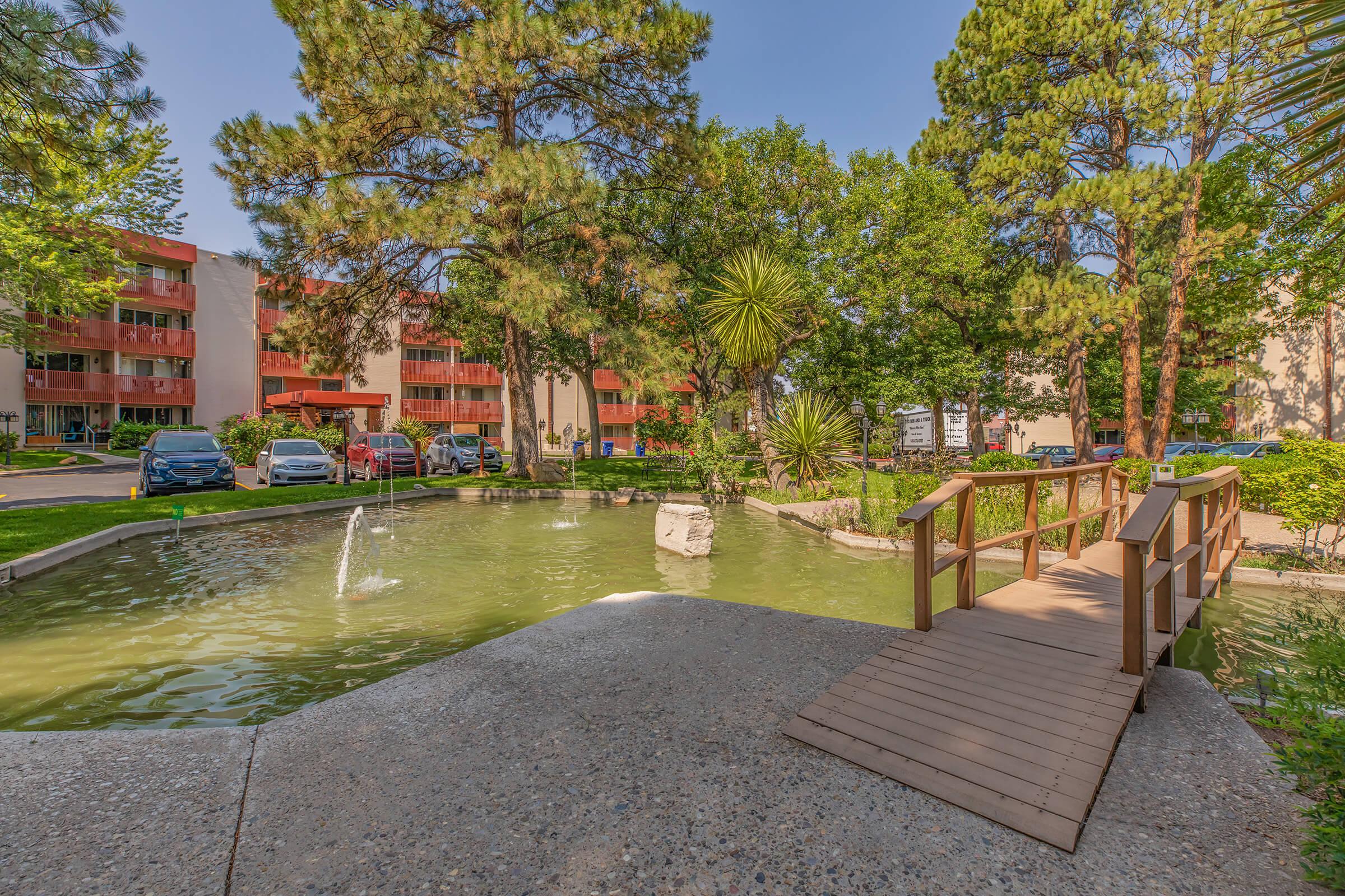 the community creek with green trees