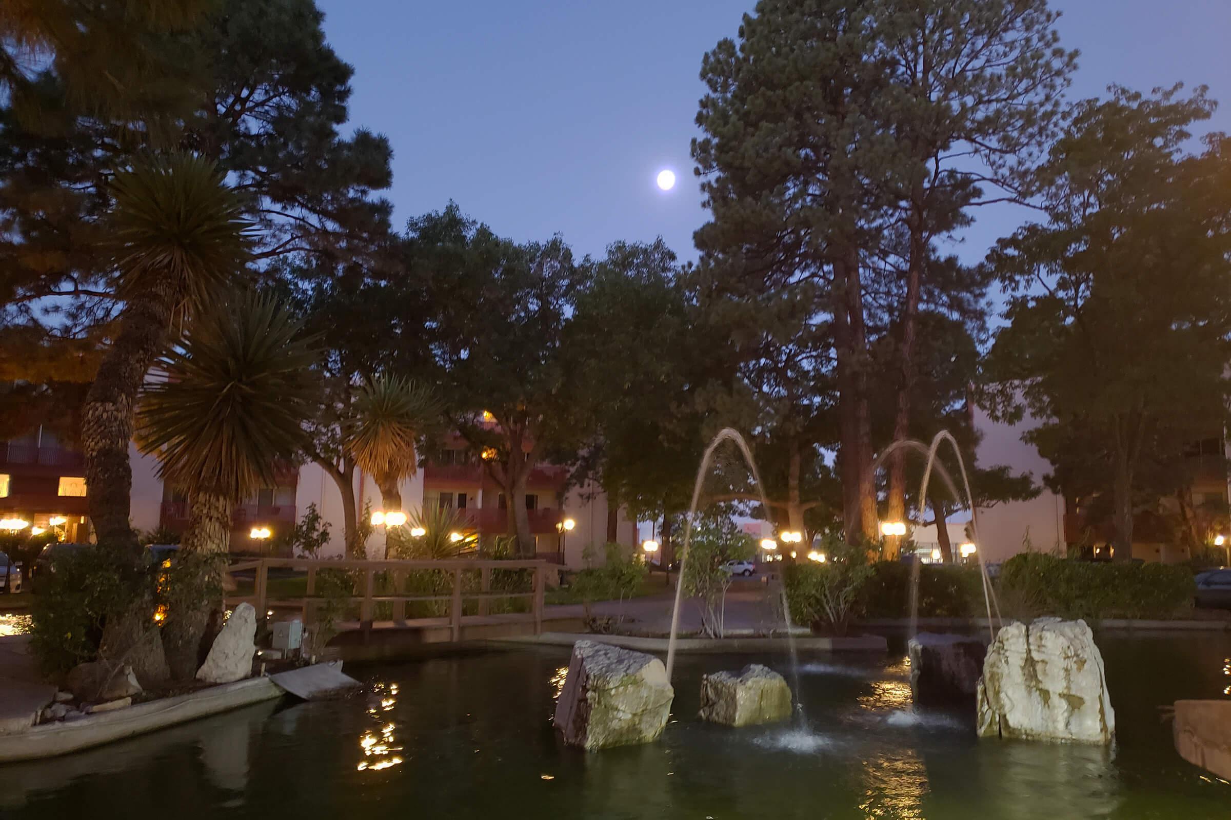 Three Fountains water feature at night