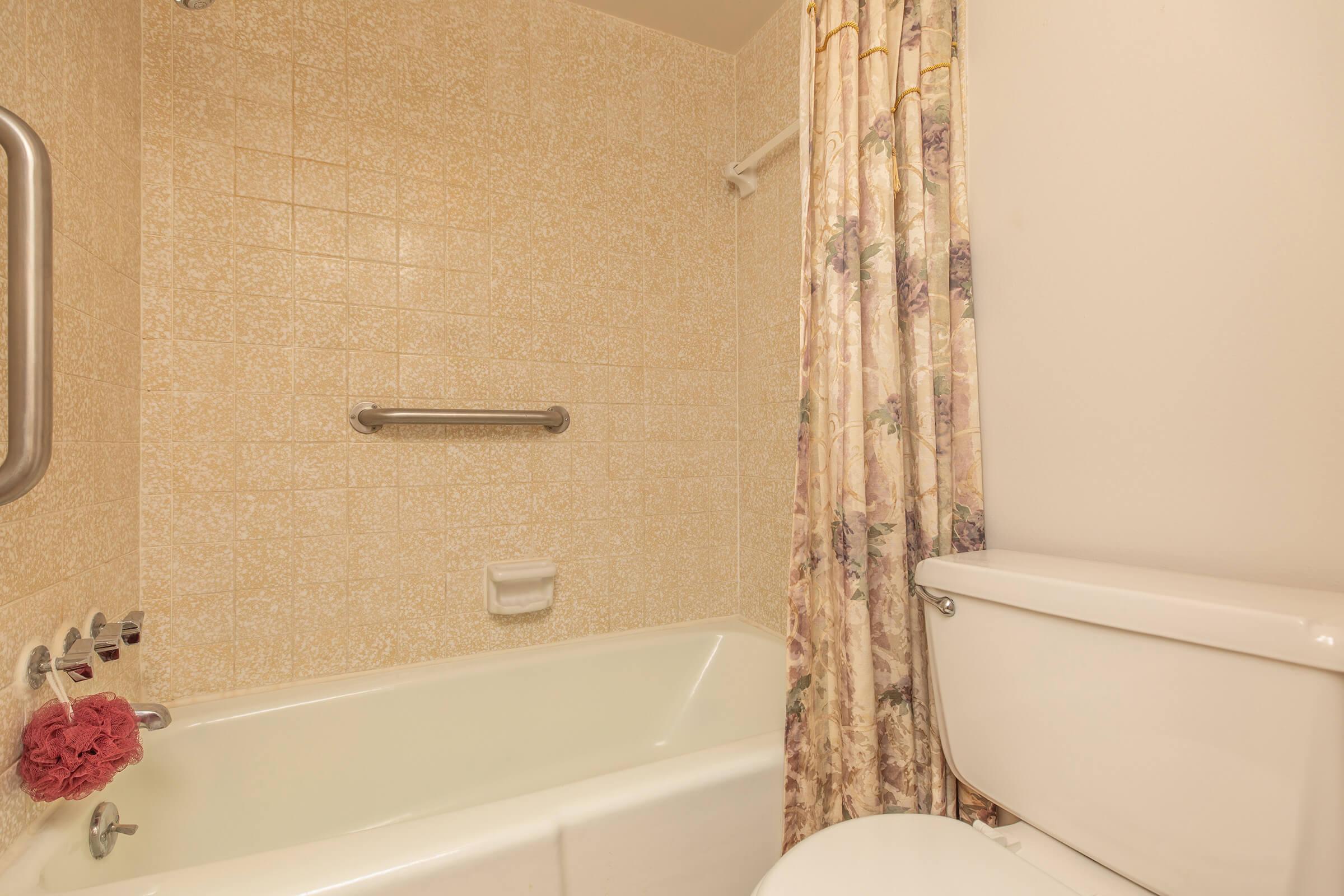 bathroom with a floral shower curtain