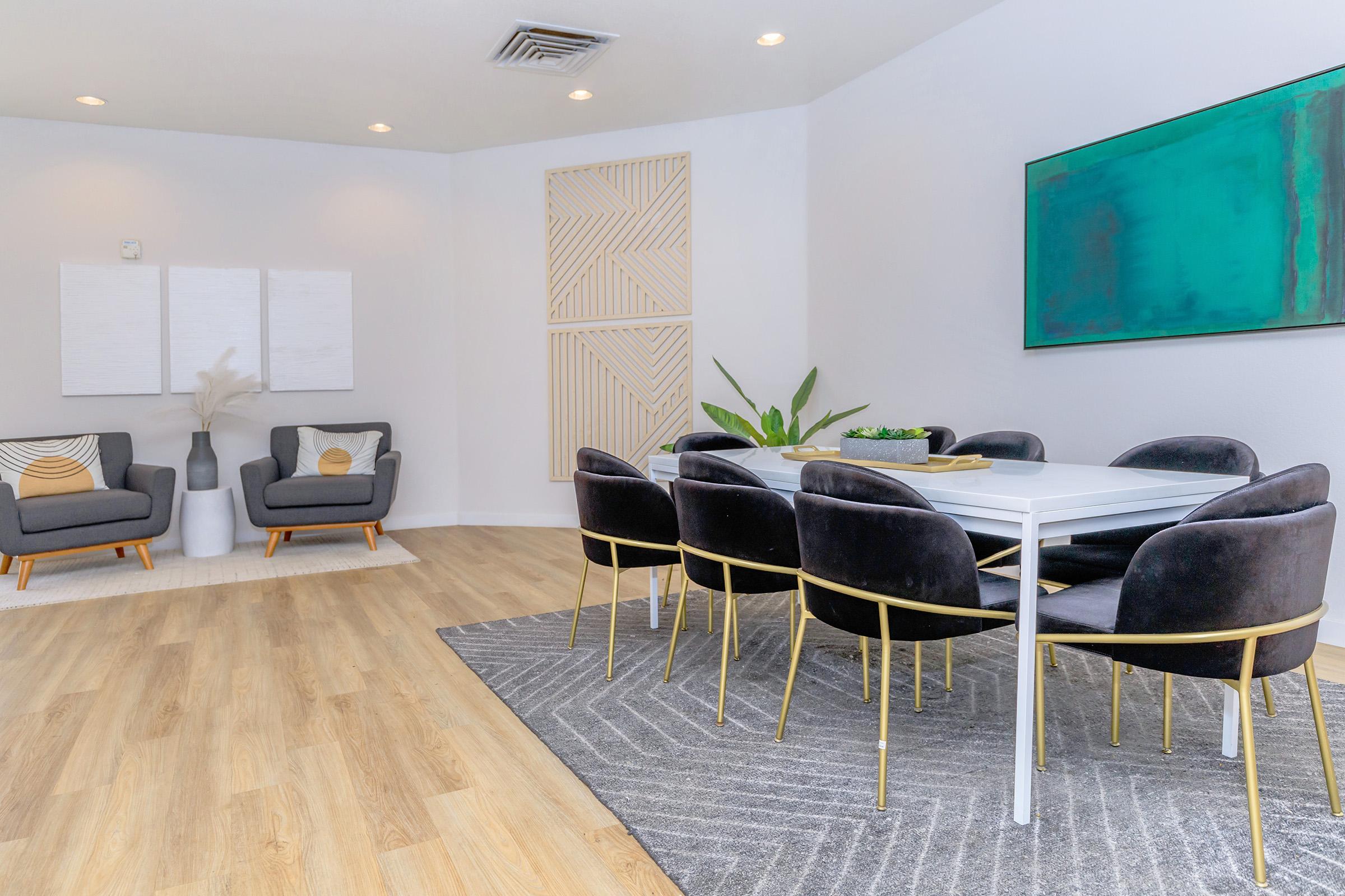 a living room filled with furniture and a table