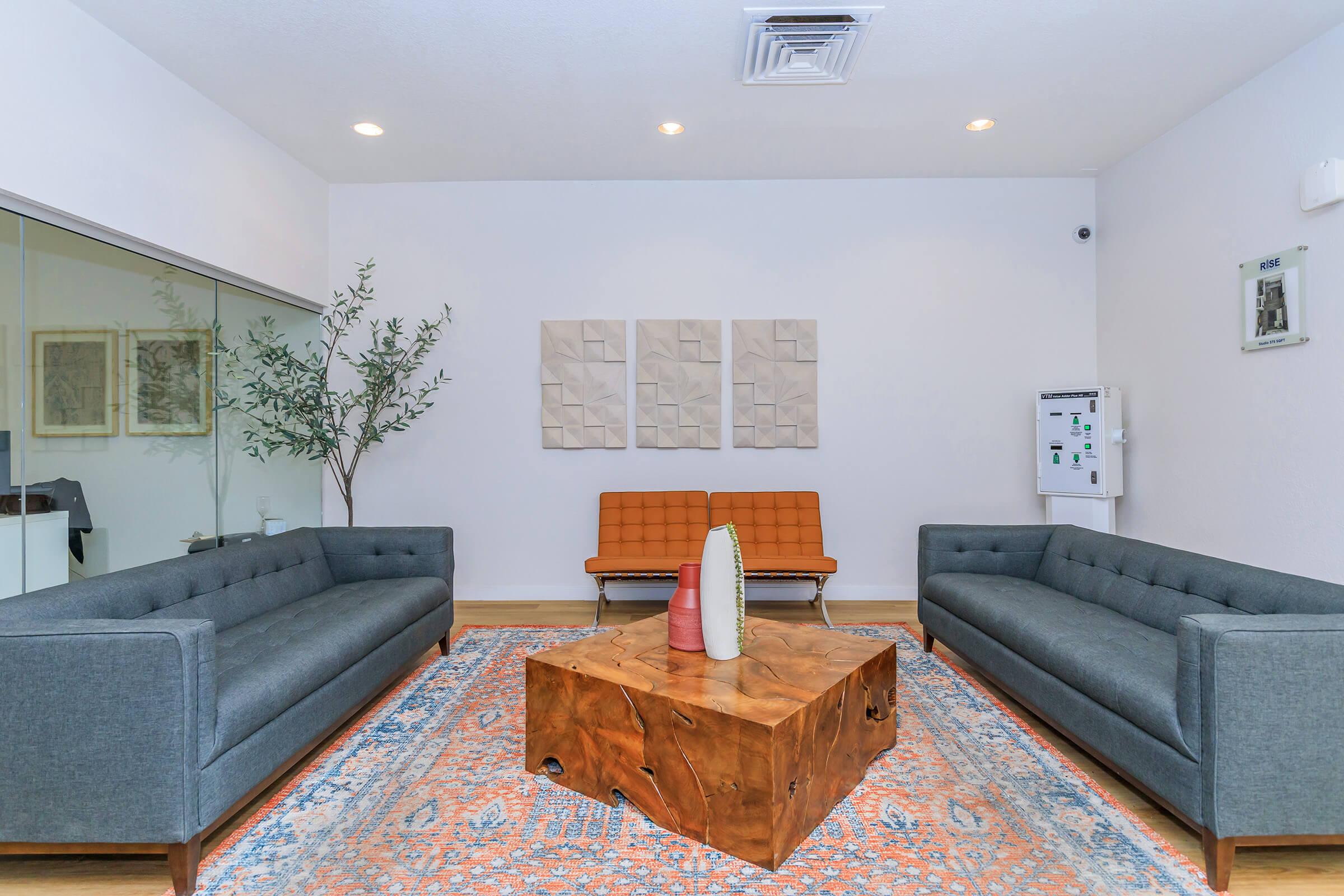 a living room filled with furniture and a flat screen tv