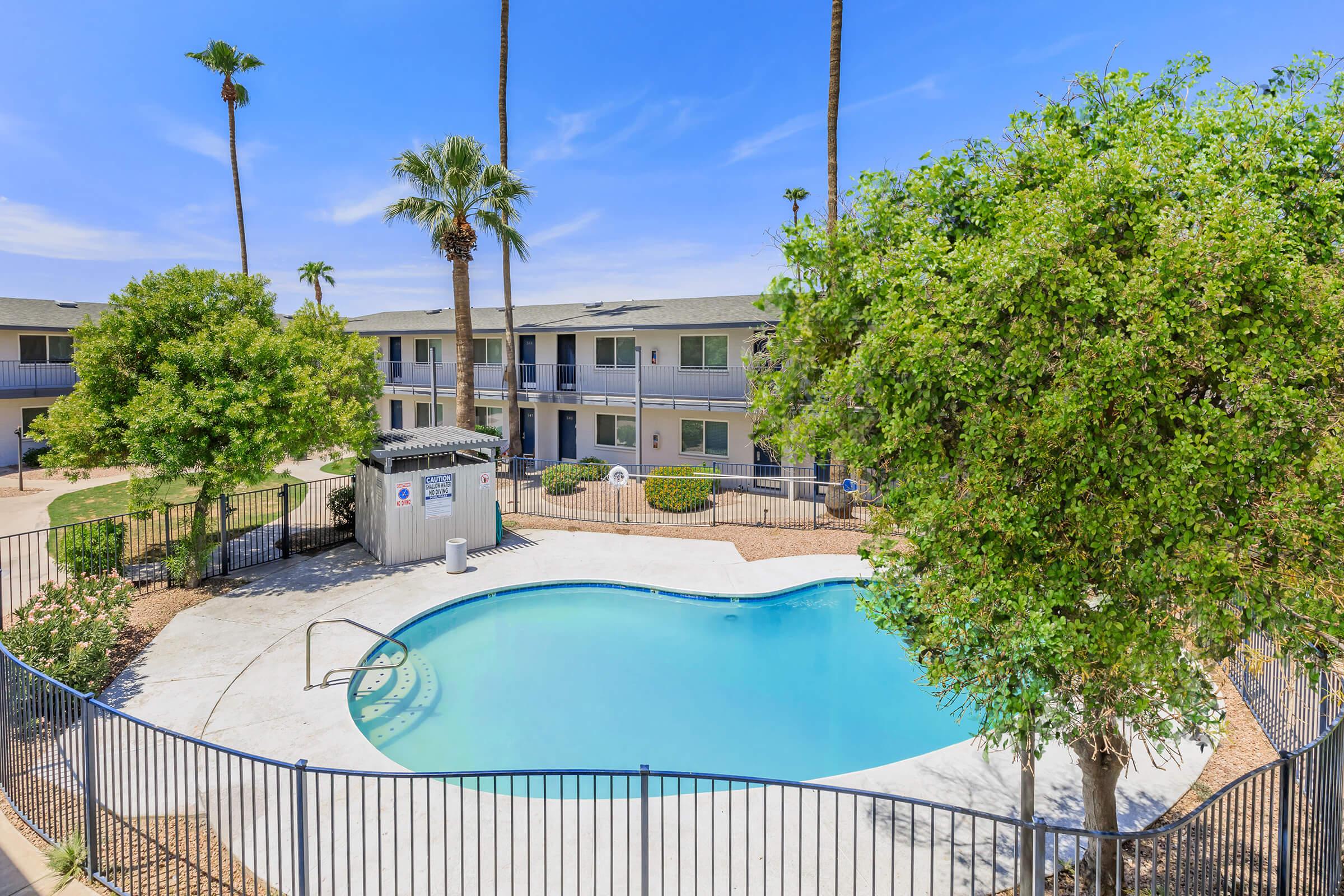 a pool next to a fence