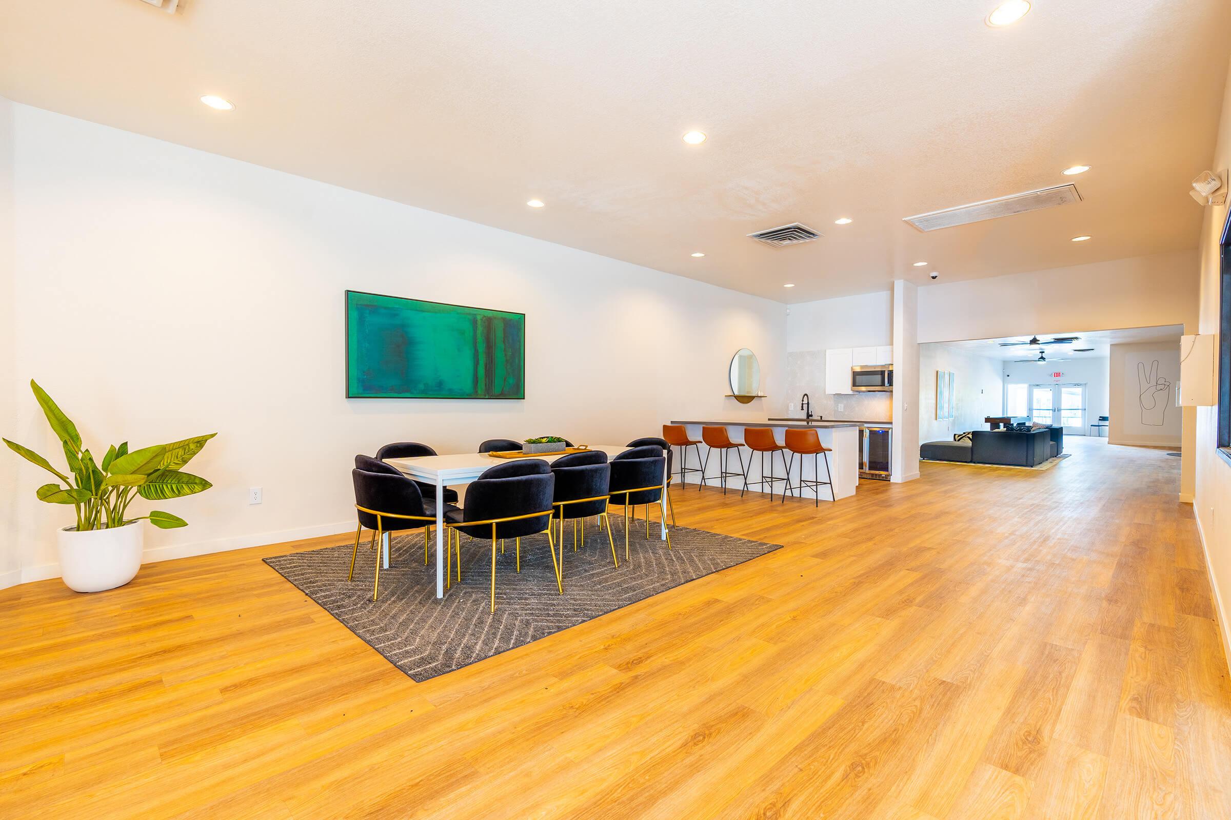 a room filled with furniture and a wood floor