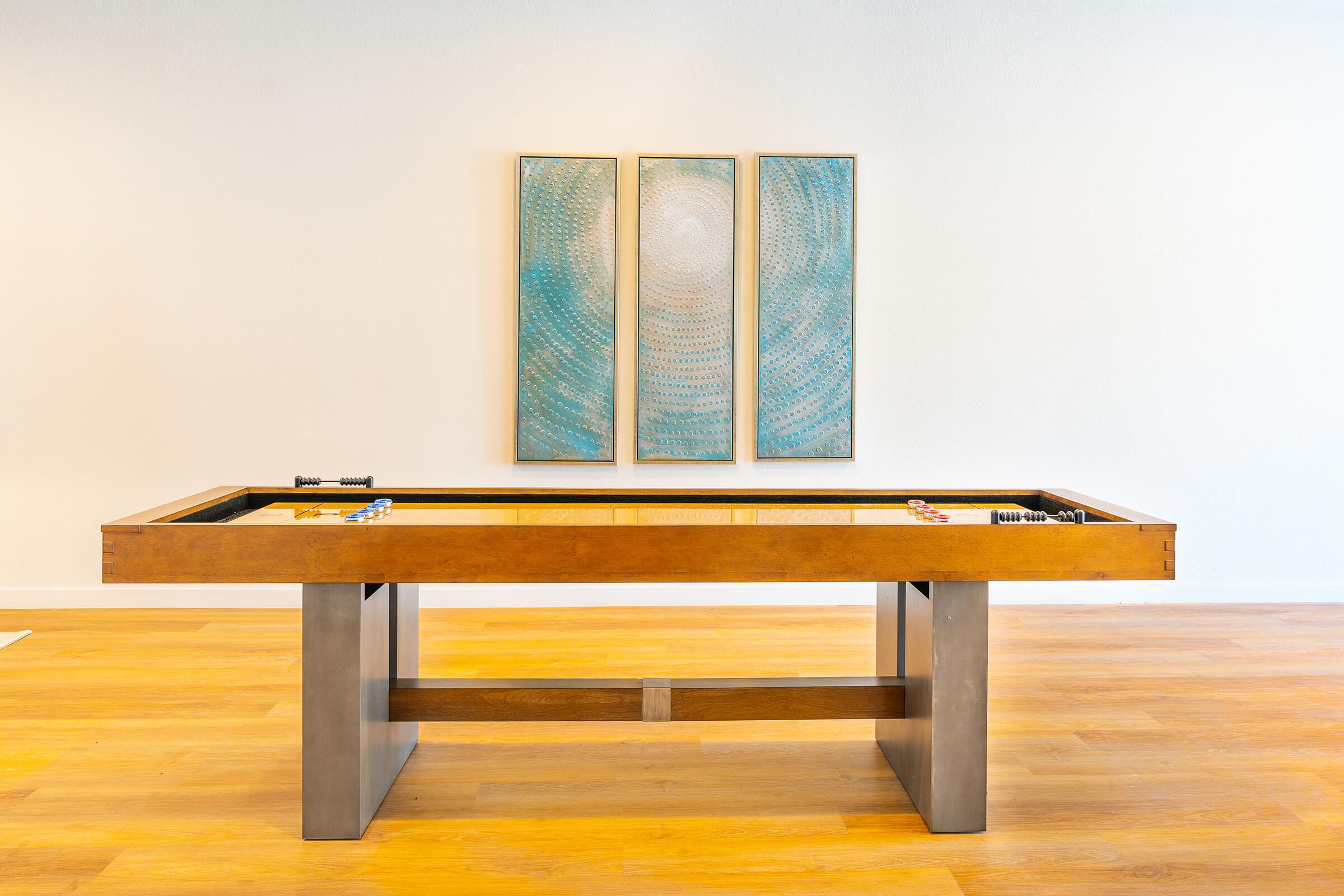 a wooden bench sitting on top of a table