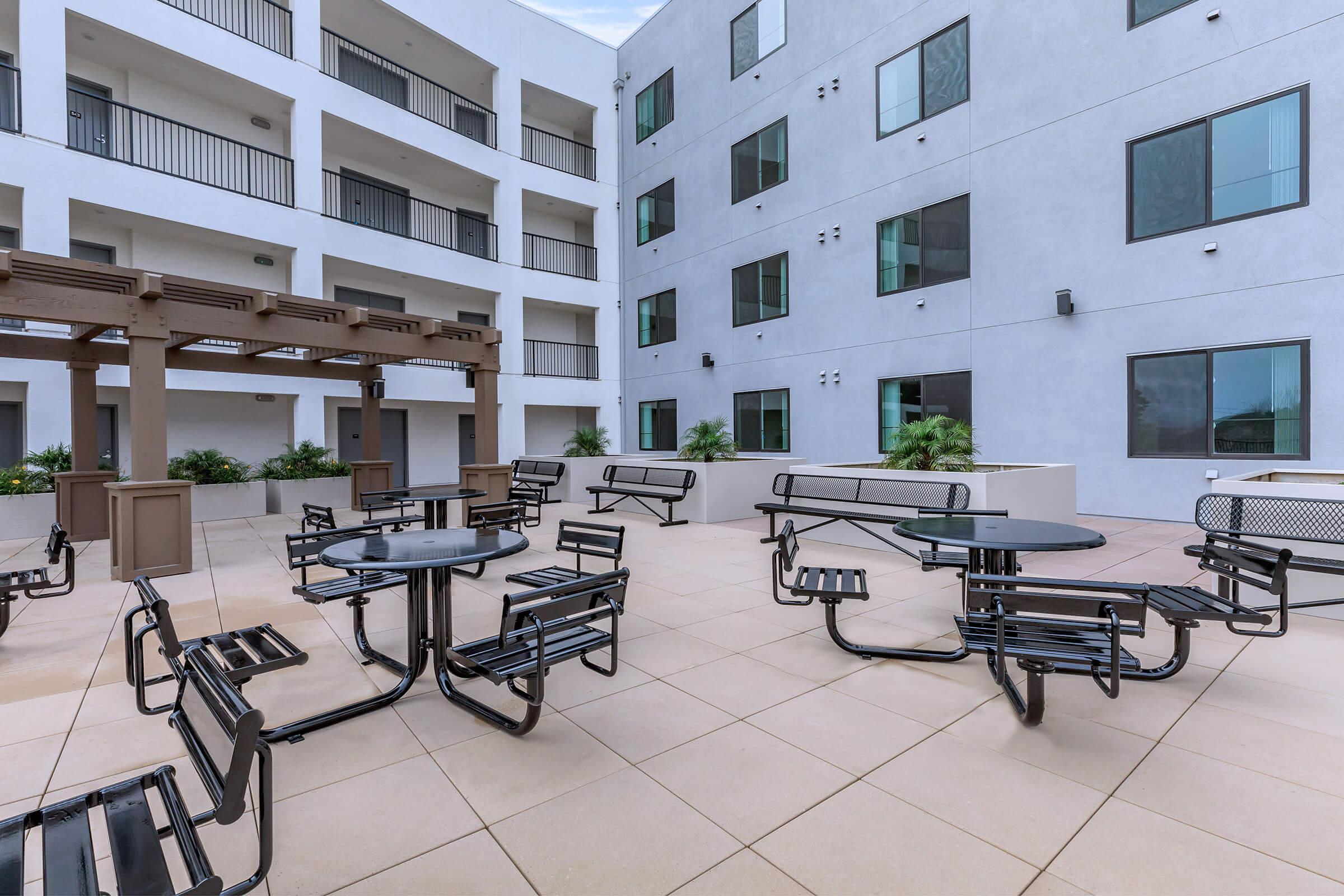 Apartments in Daly City CA-Brunswick Street Outdoor Seating with Lots of Tables and Chairs and Beatufiul Plants