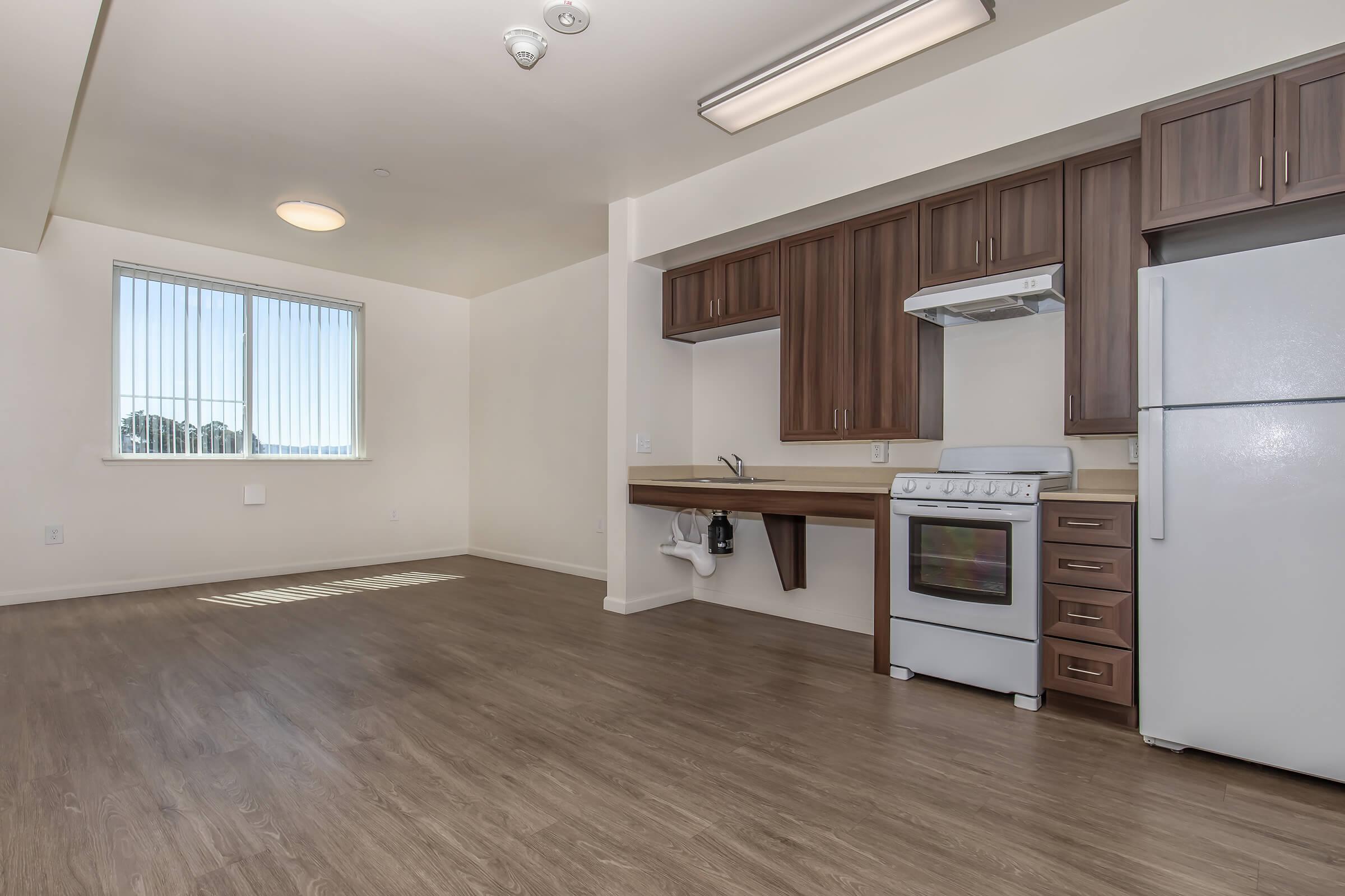 a kitchen with a wood floor