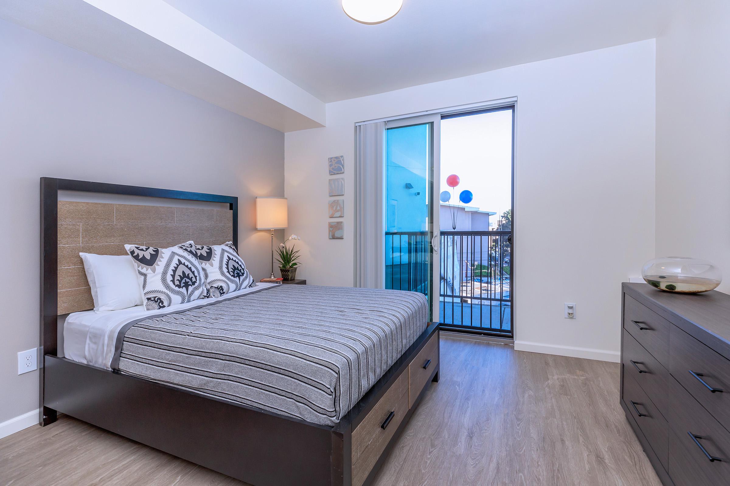 Apartments in Daly City CA for Rent-Brunswick Street Bedroom with Private Balcony, Hardwood-Styled Flooring, and Spacious Floor Plan Area