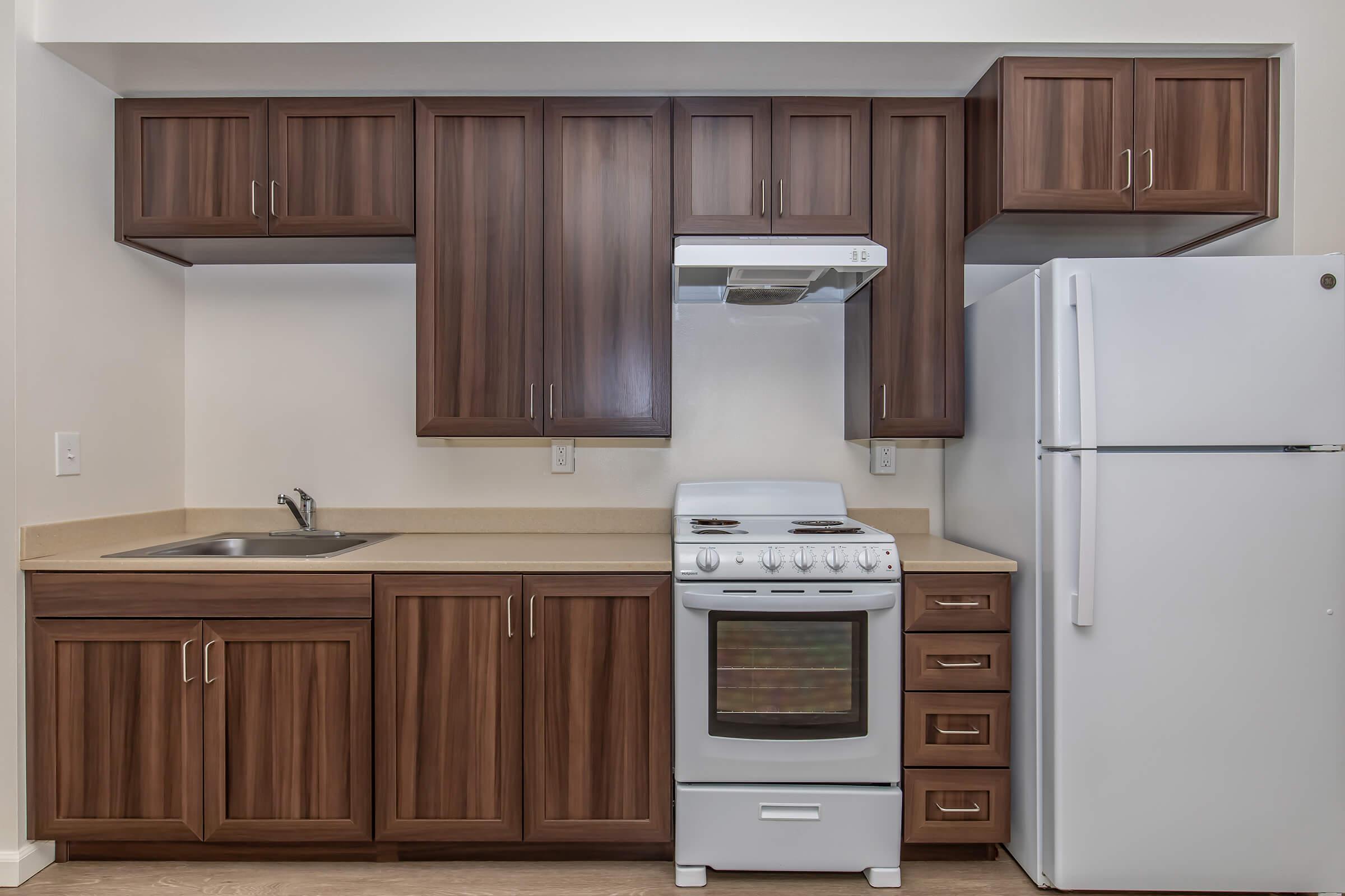 a kitchen with a stove top oven sitting inside of a refrigerator