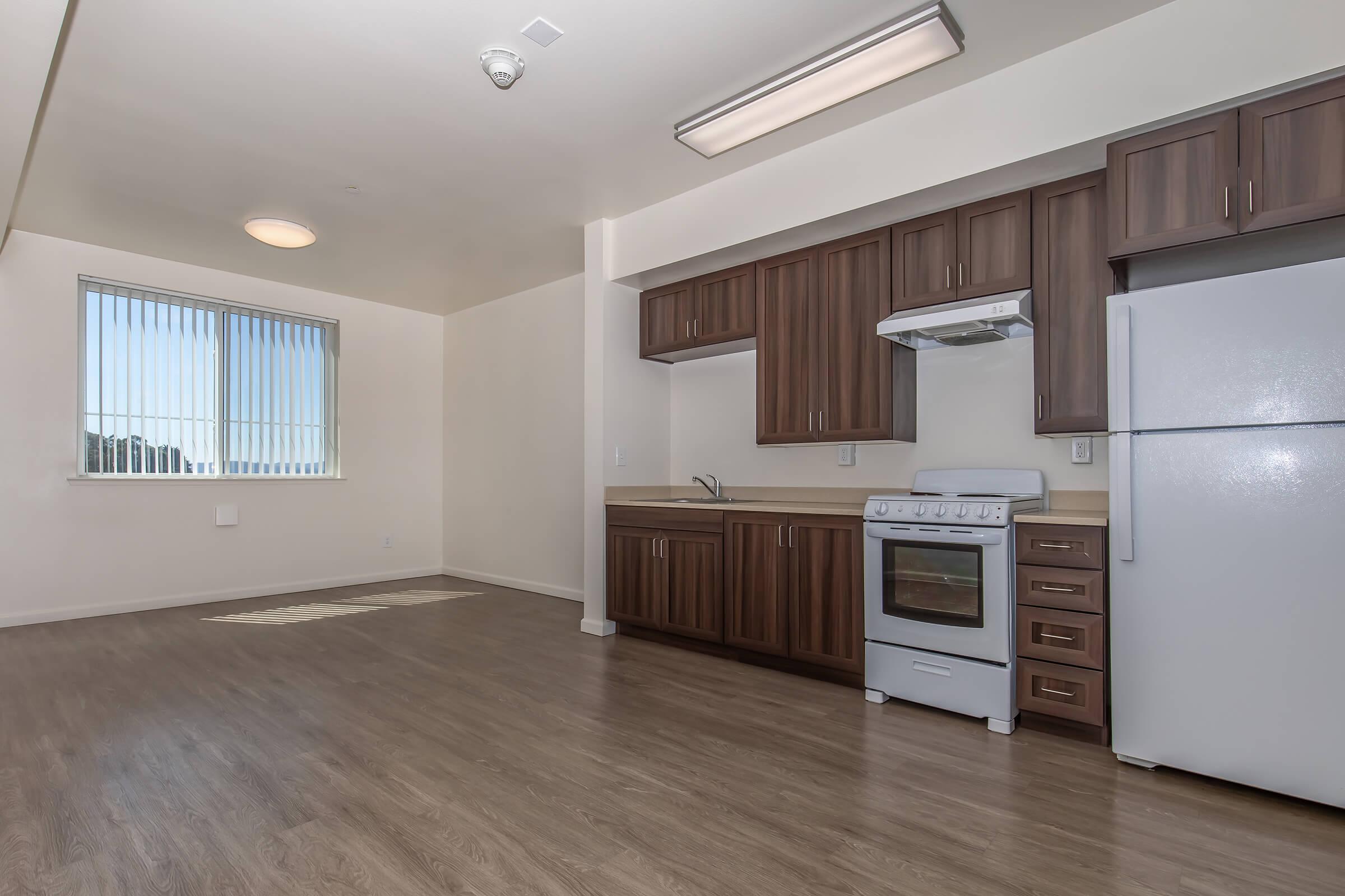 a kitchen with a wood floor