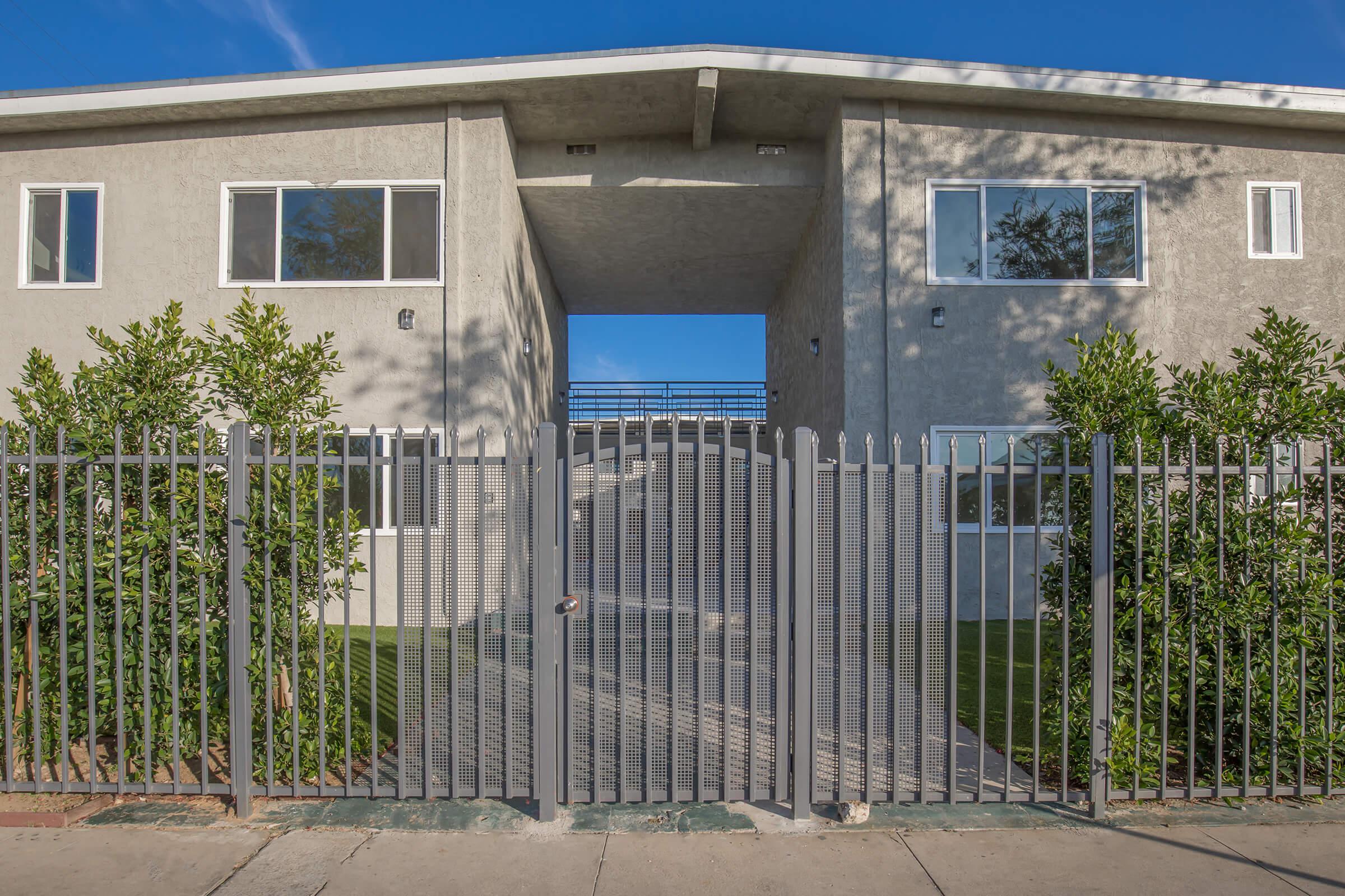 a building with a metal fence