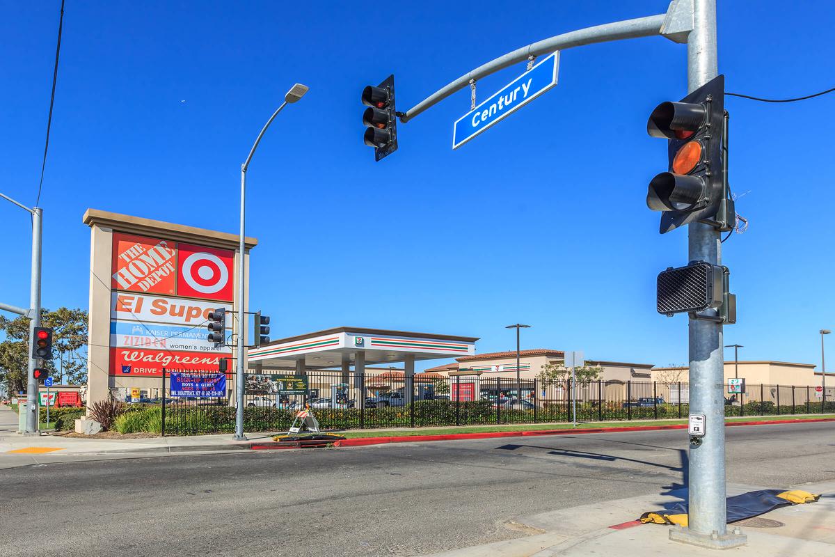 a pole that has a sign on the side of a road