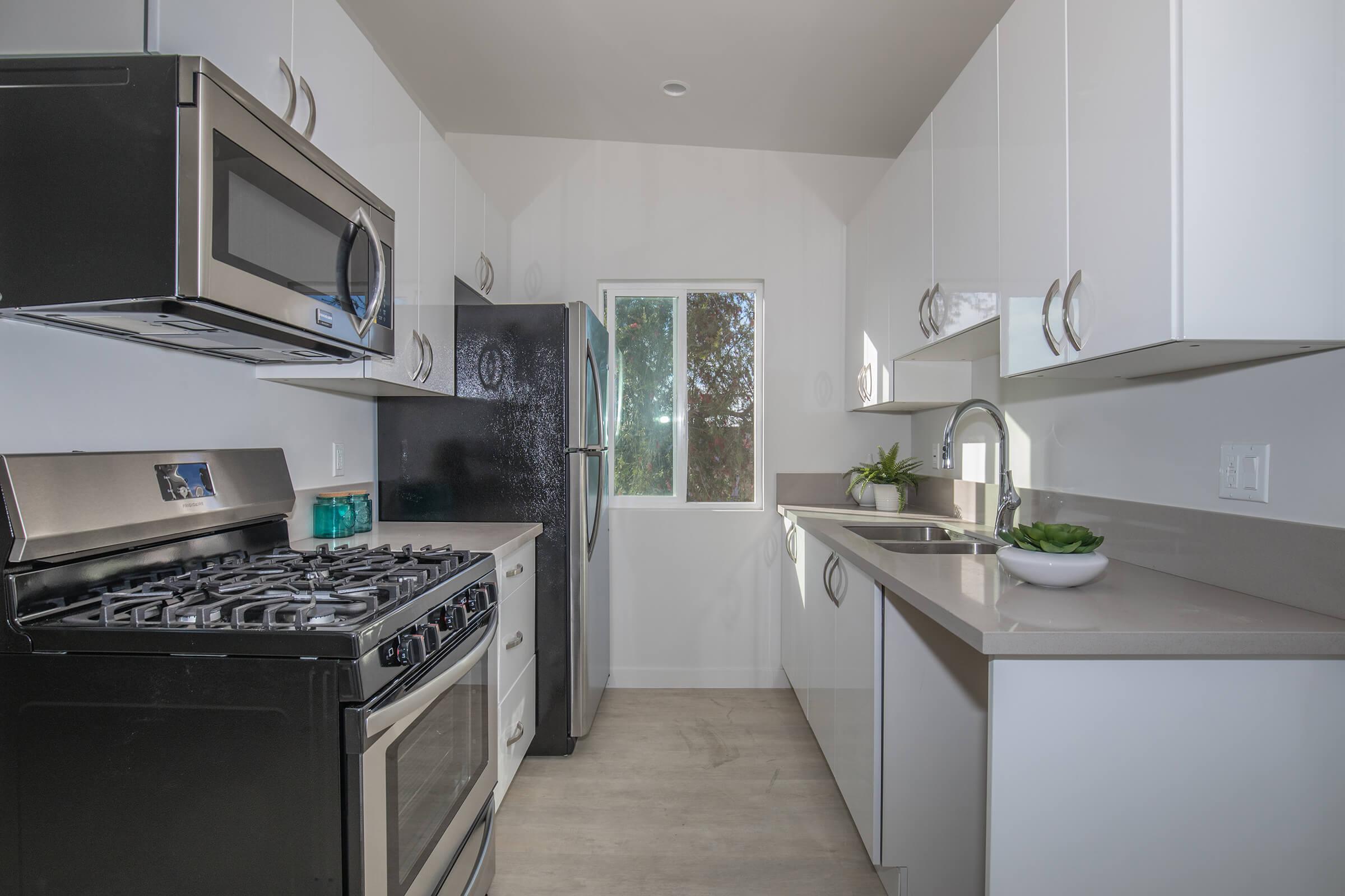 a kitchen with a stove and a sink