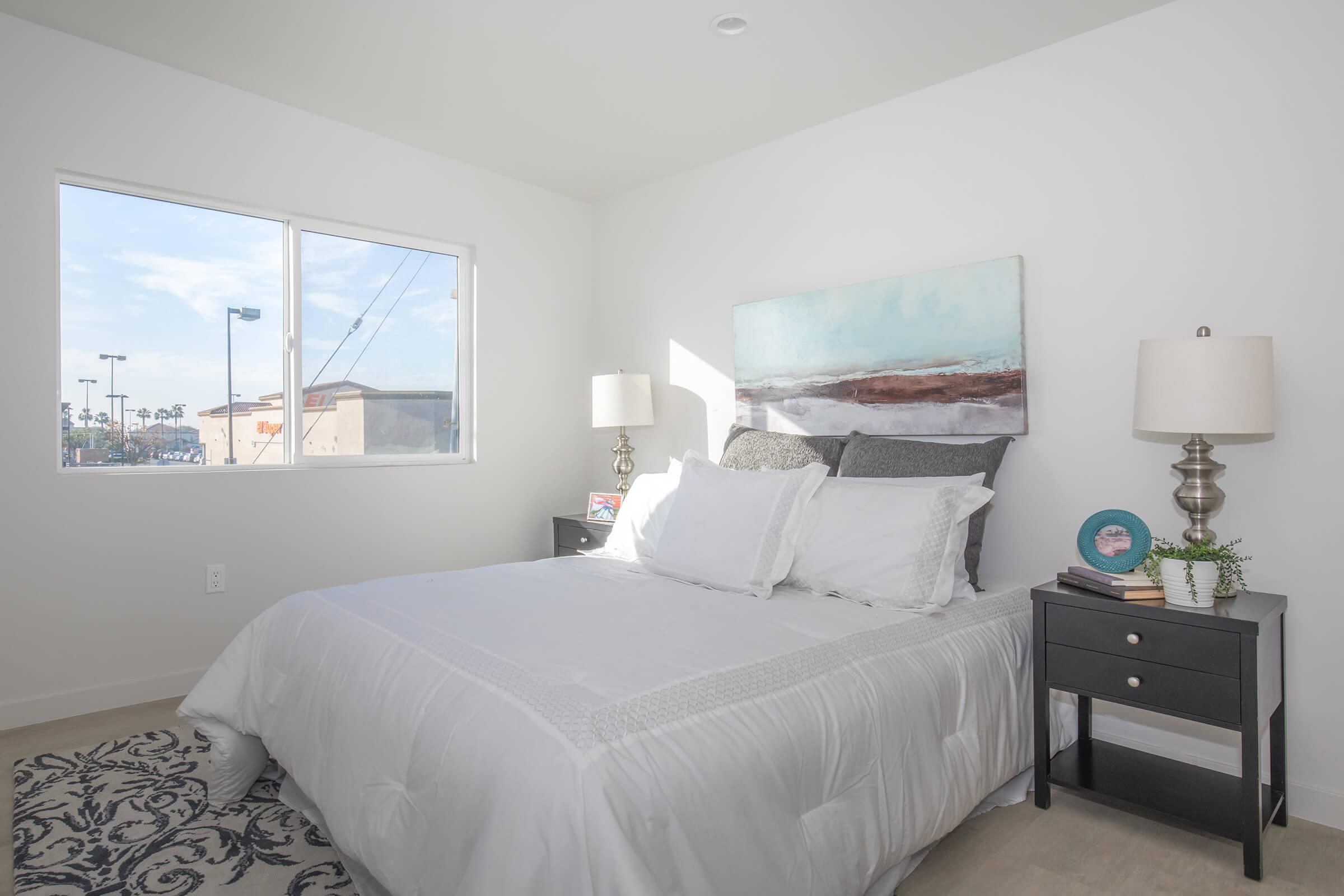 a bedroom with a bed in a hotel room