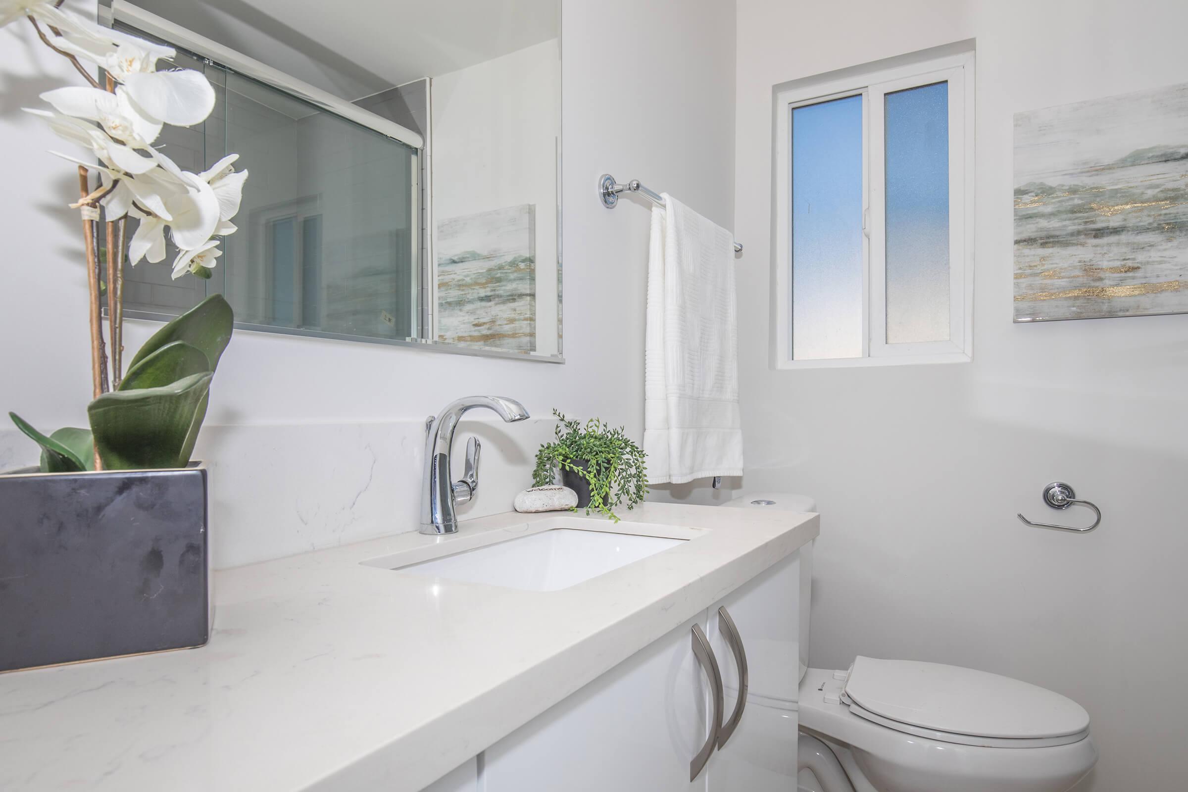 a large white tub next to a window