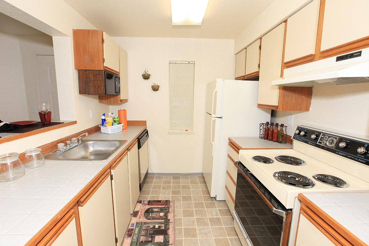 a kitchen with a stove top oven sitting inside of a refrigerator