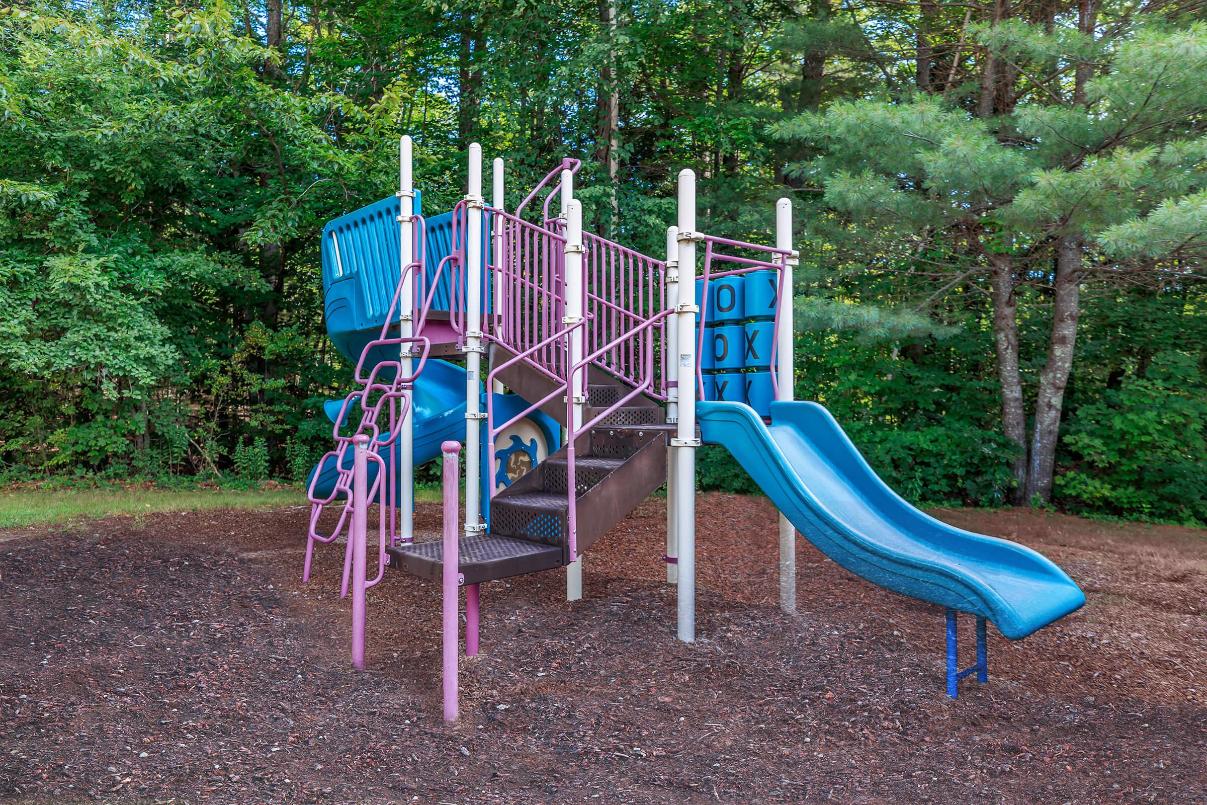 a blue seat on a slide