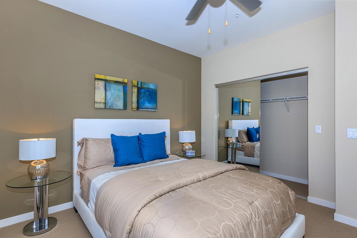 a bedroom with a bed in a room