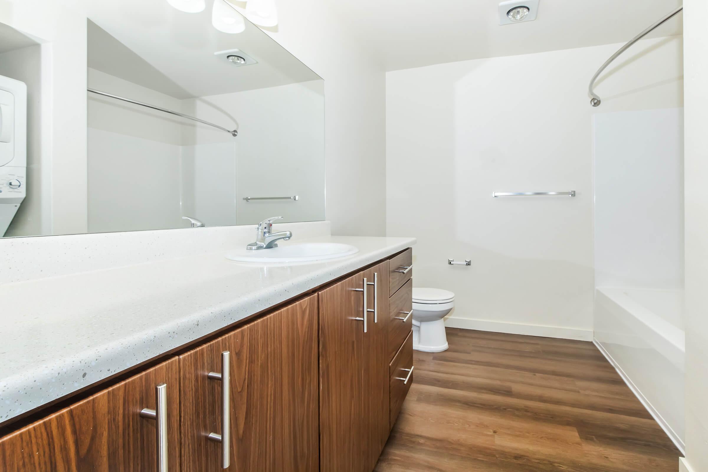 a kitchen with a sink and a mirror