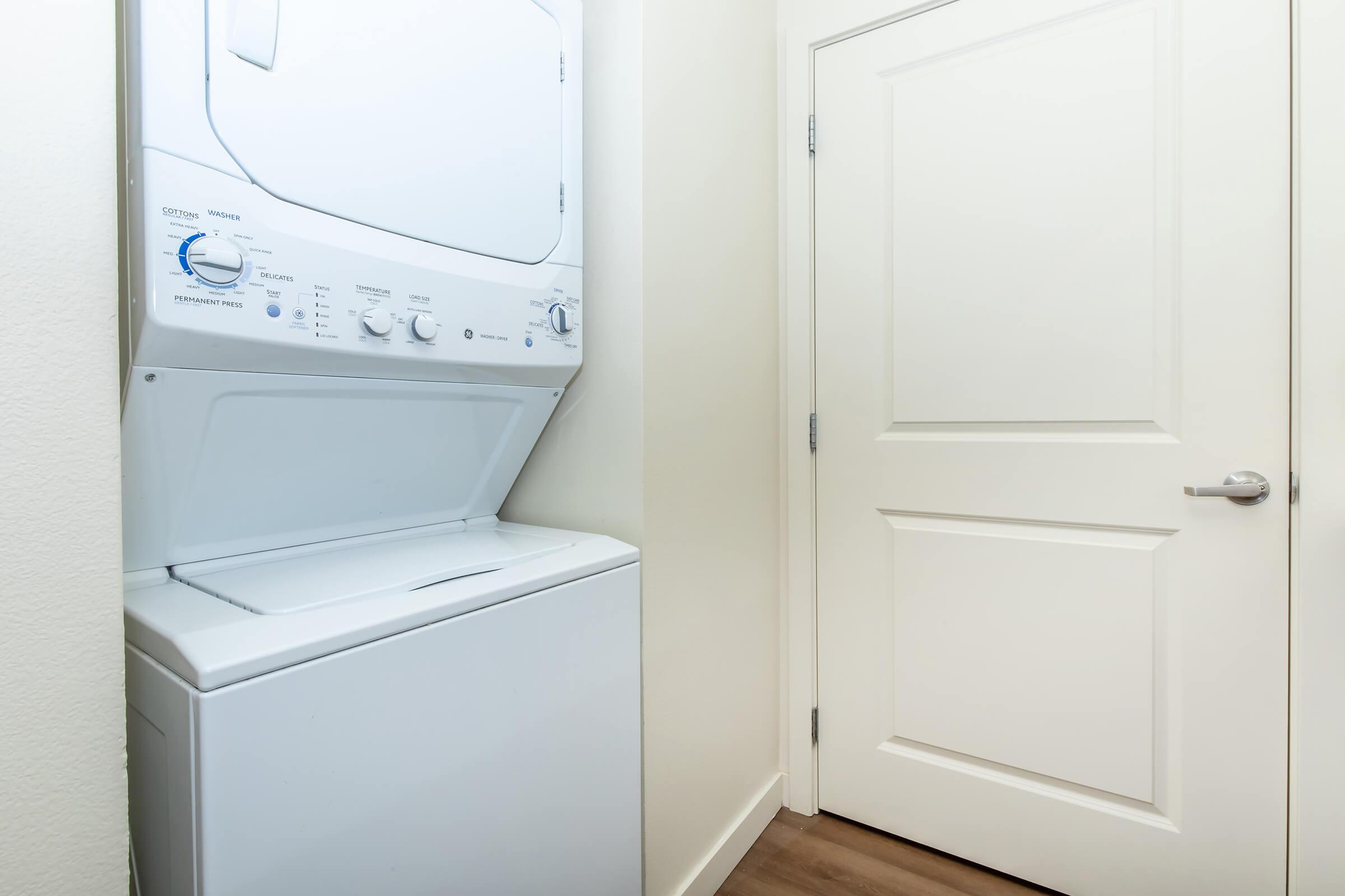 a microwave oven sitting on top of a refrigerator