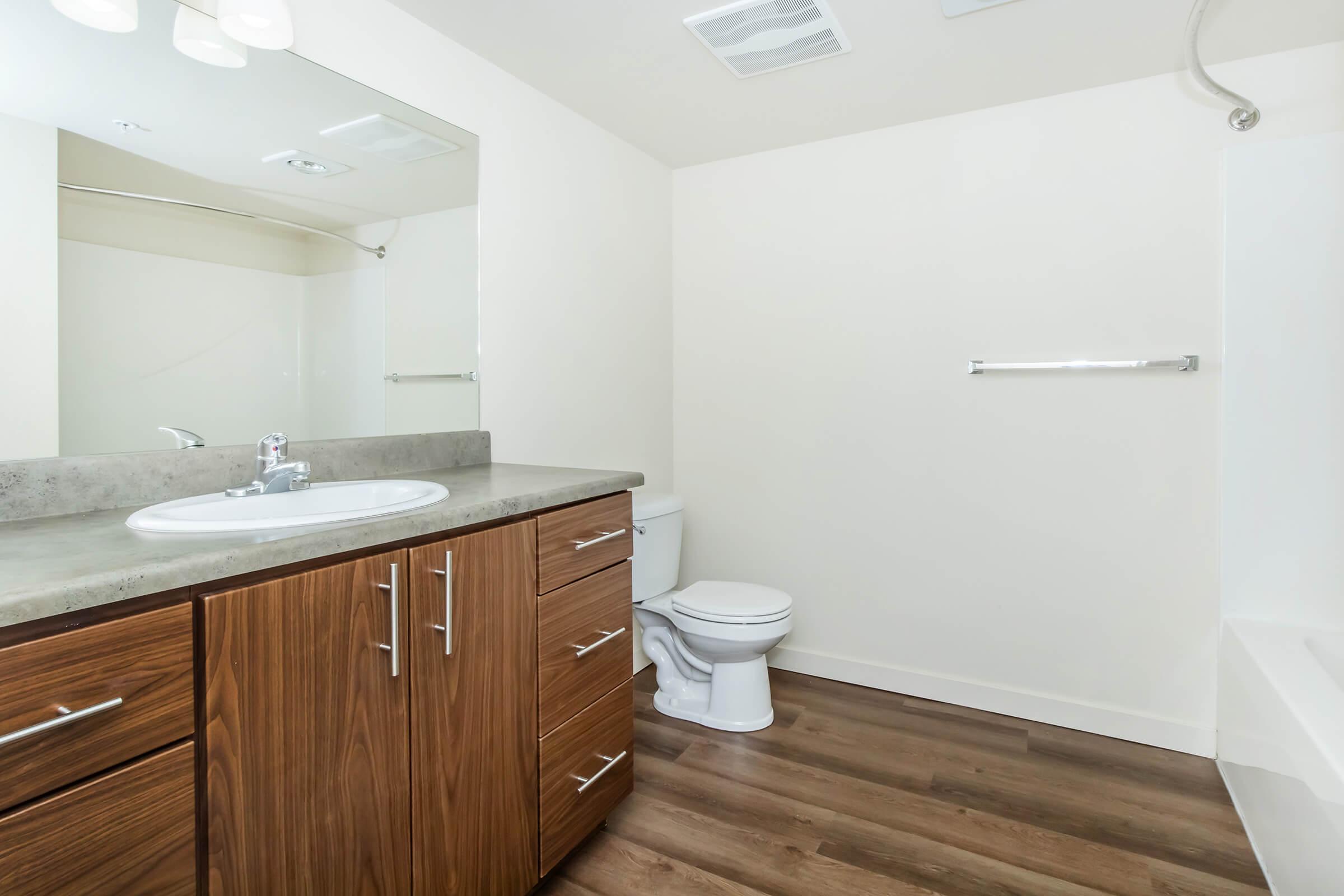 a kitchen with a sink and a mirror