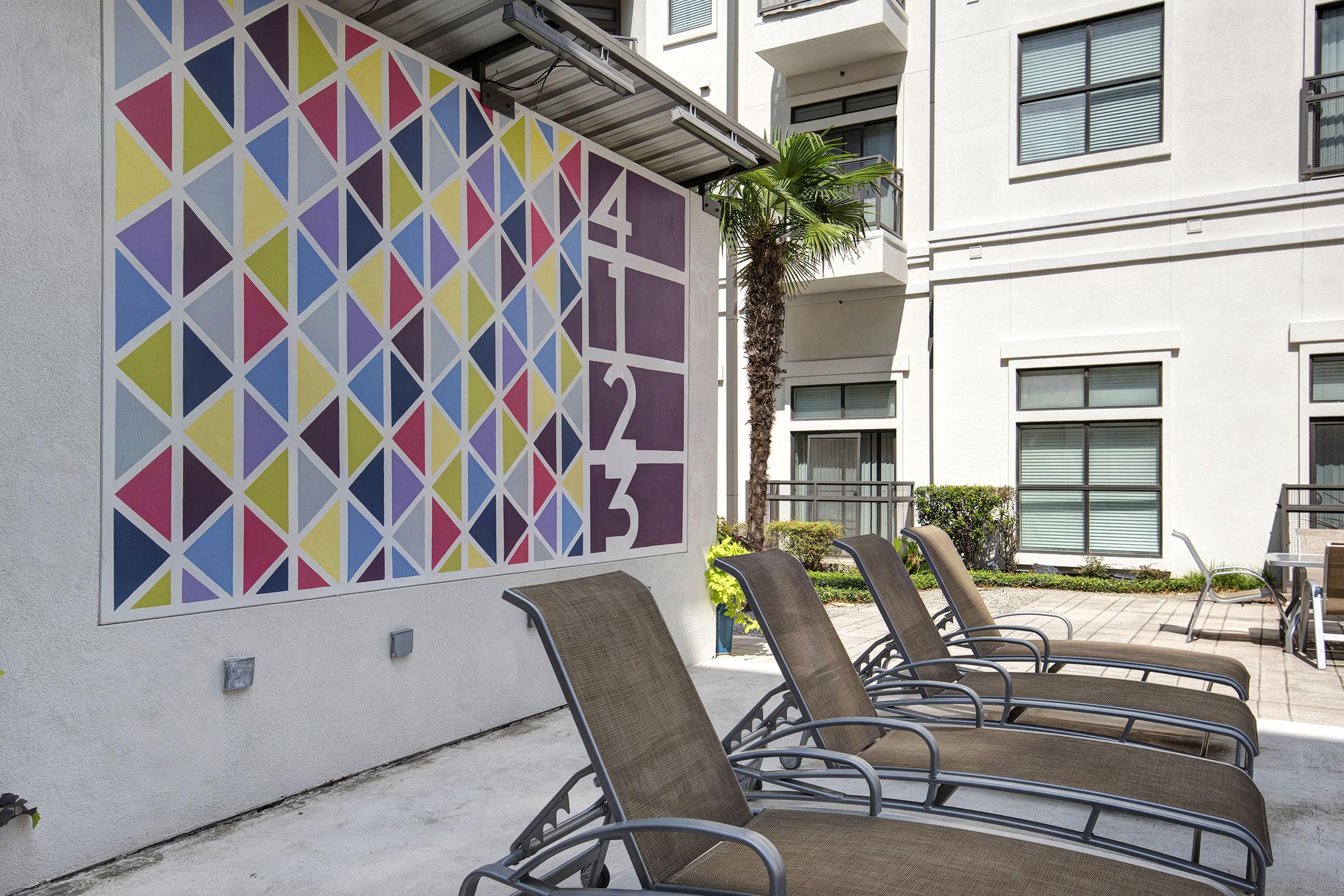 a chair sitting in front of a building