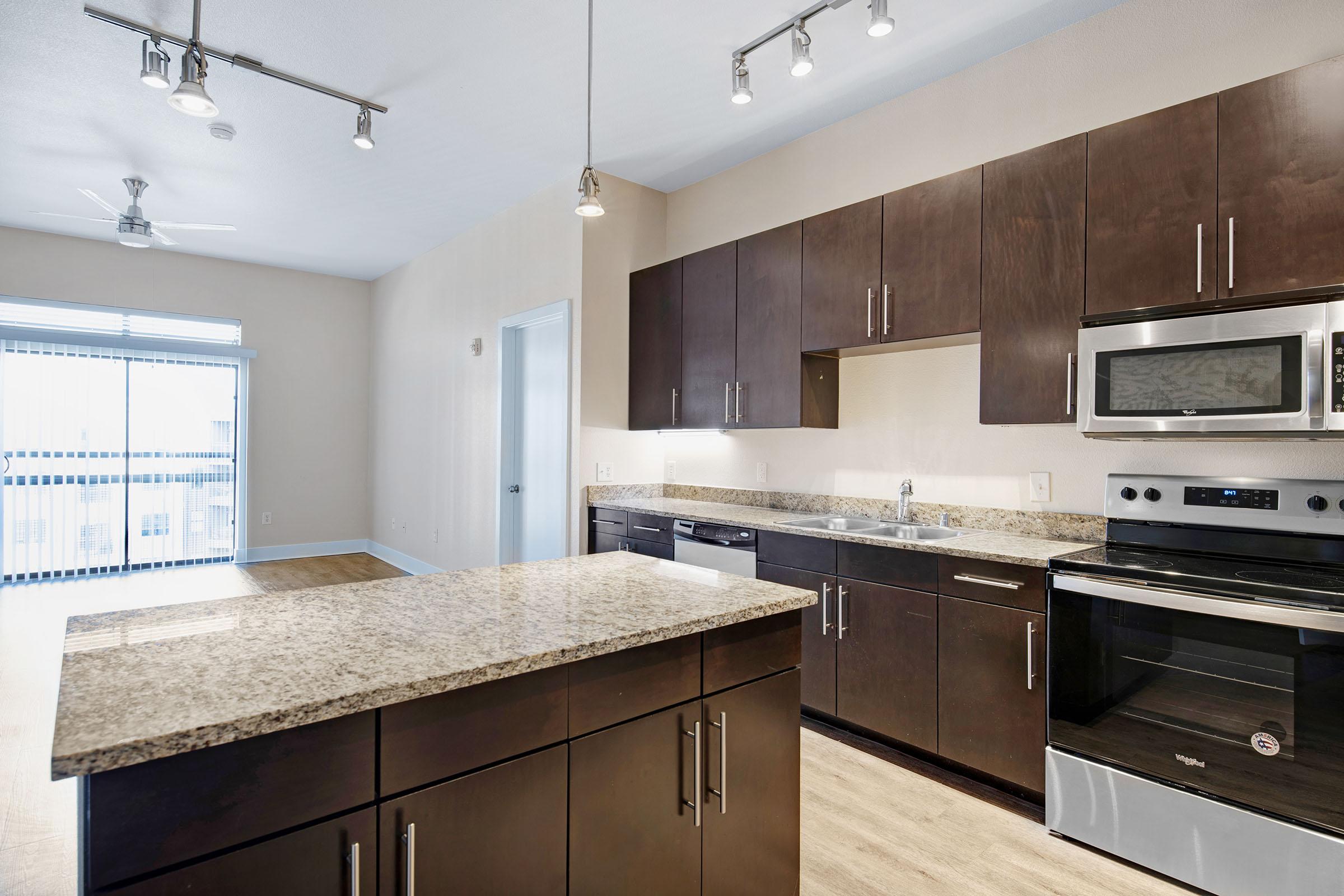 a large kitchen with stainless steel appliances