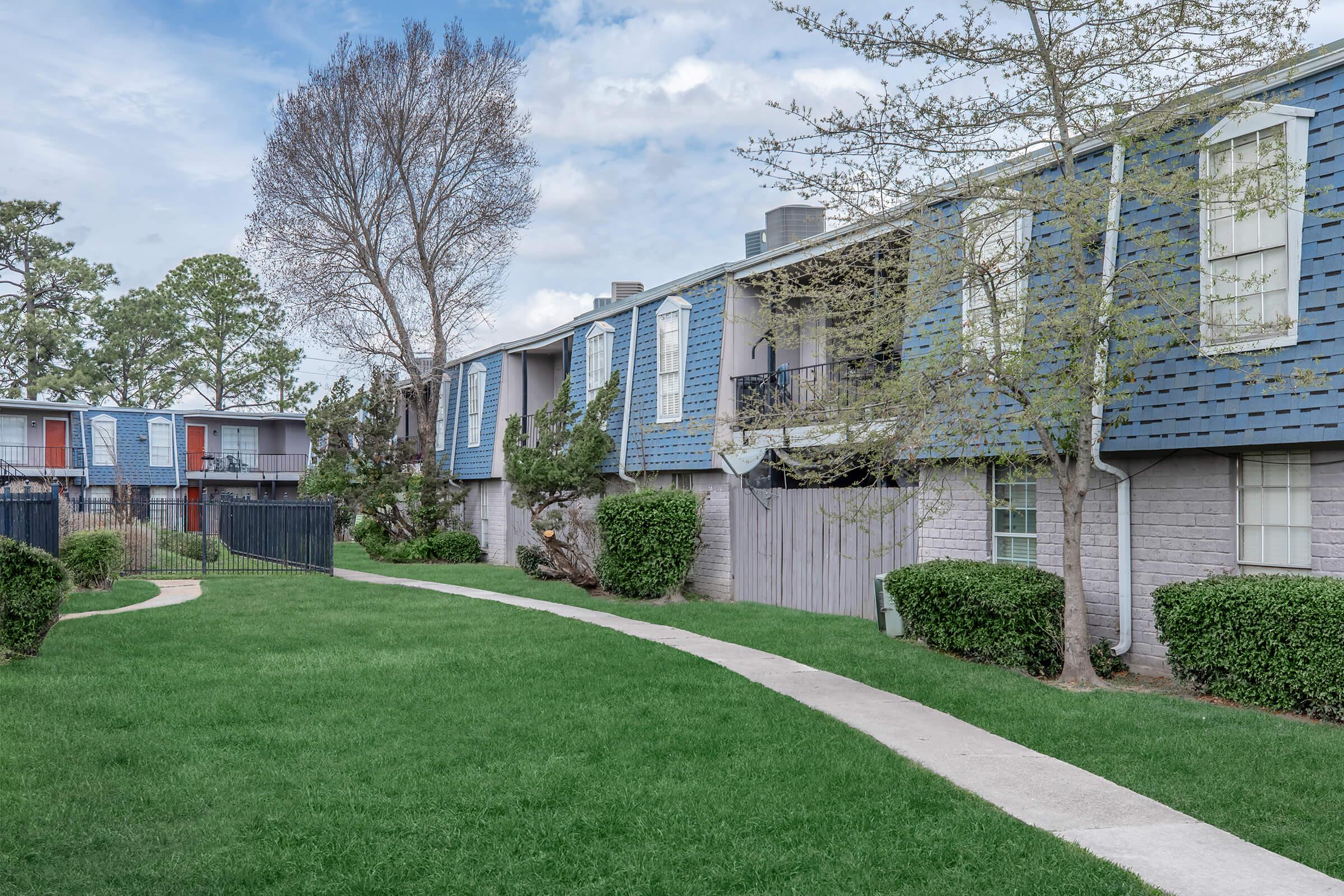 a large lawn in front of a house