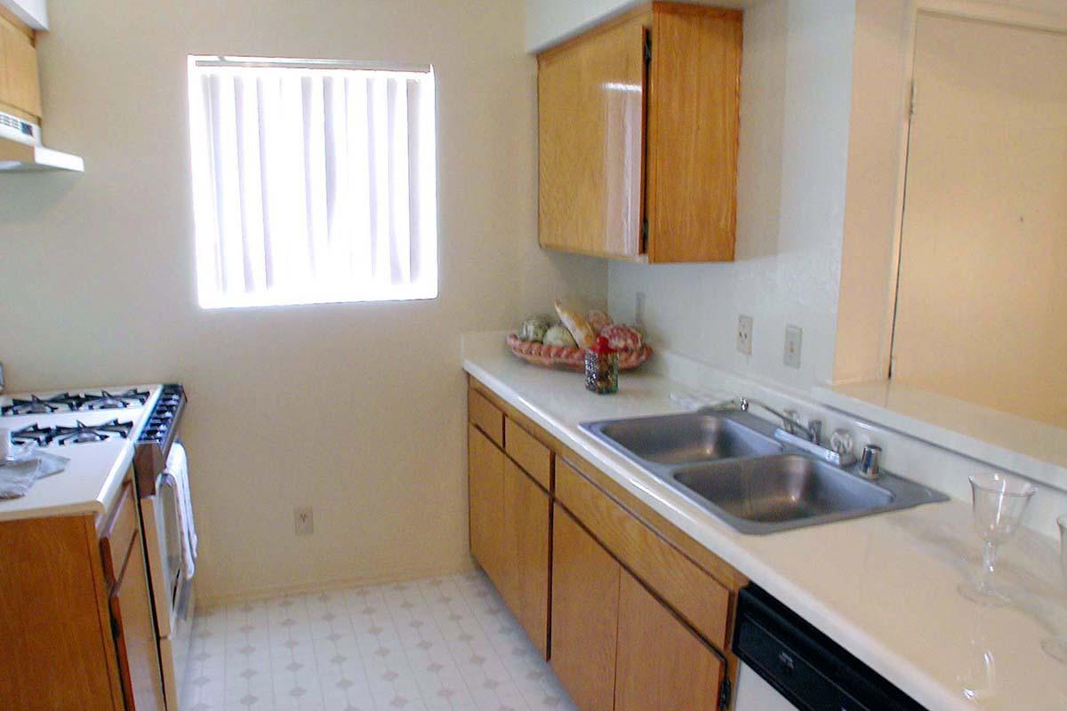 a kitchen with a stove and a sink