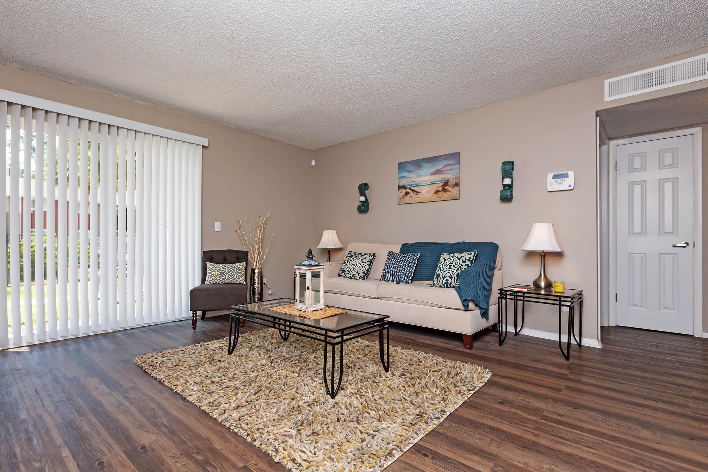 a living room filled with furniture and a table
