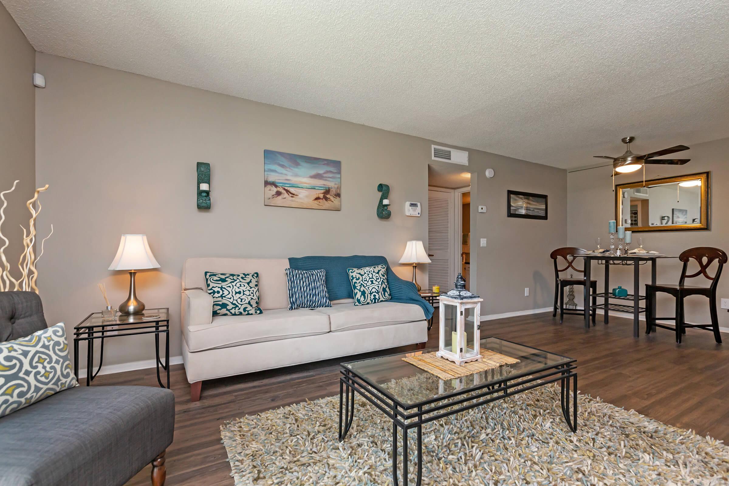 a living room filled with furniture and a table