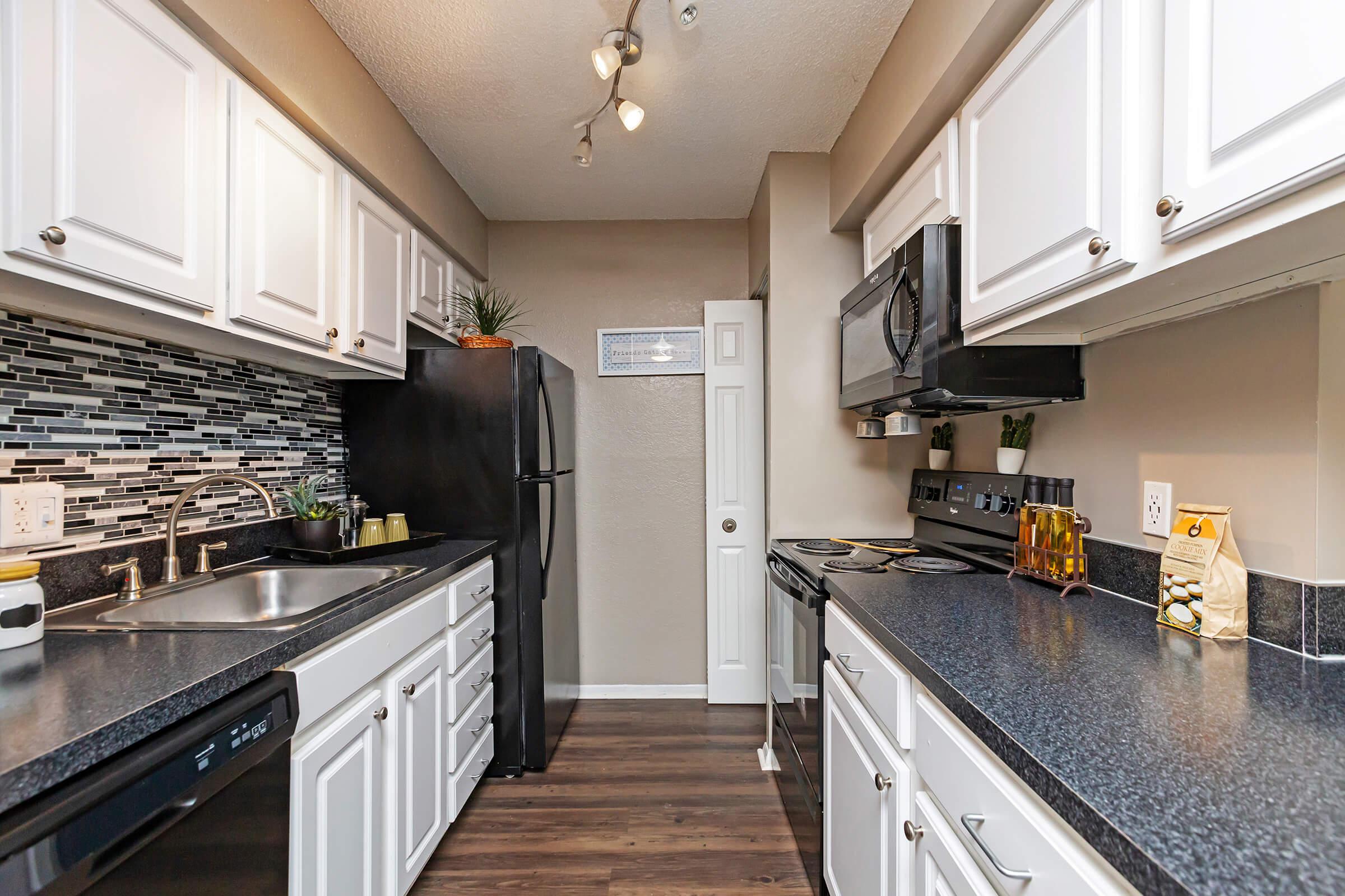 a modern kitchen with stainless steel appliances