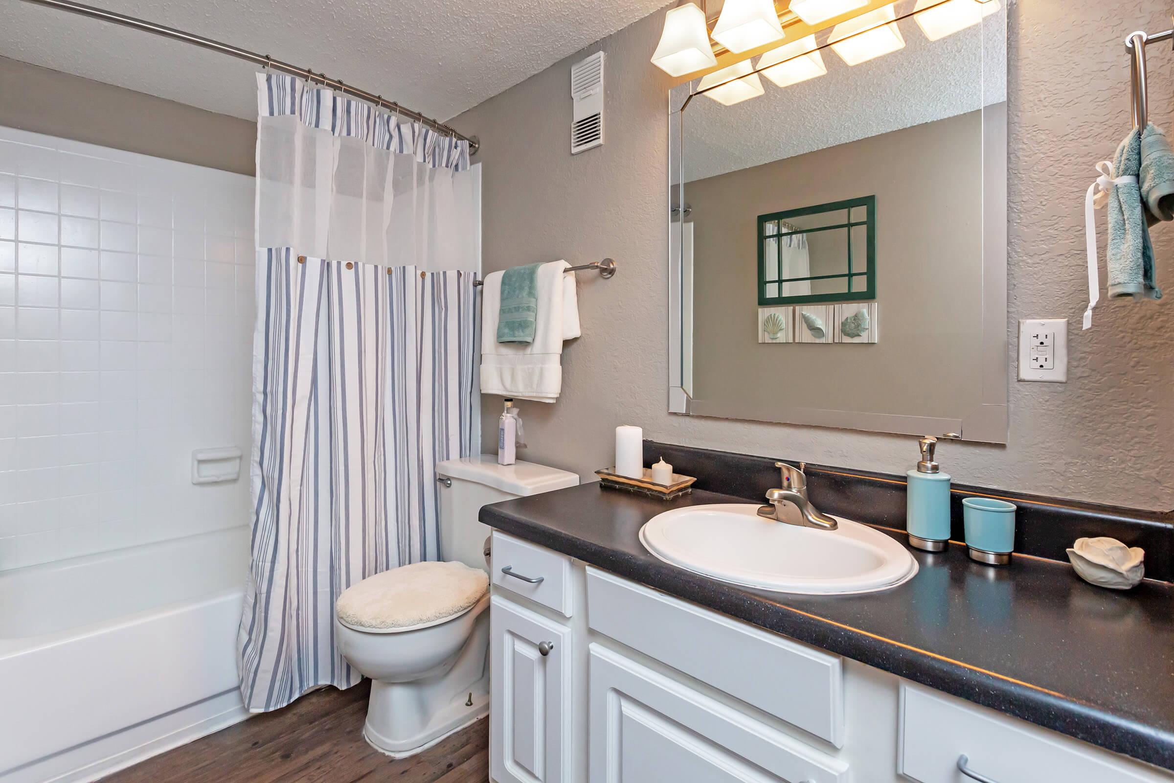 a kitchen with a sink and a mirror