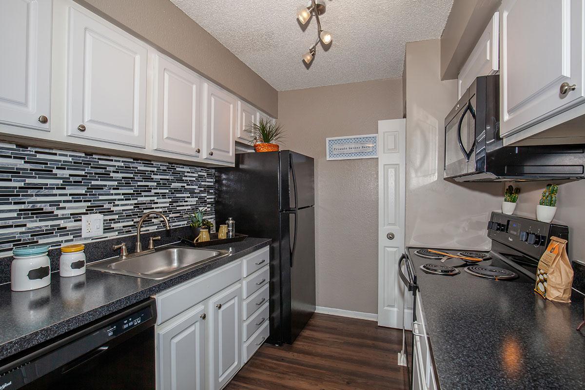 a large kitchen with stainless steel appliances