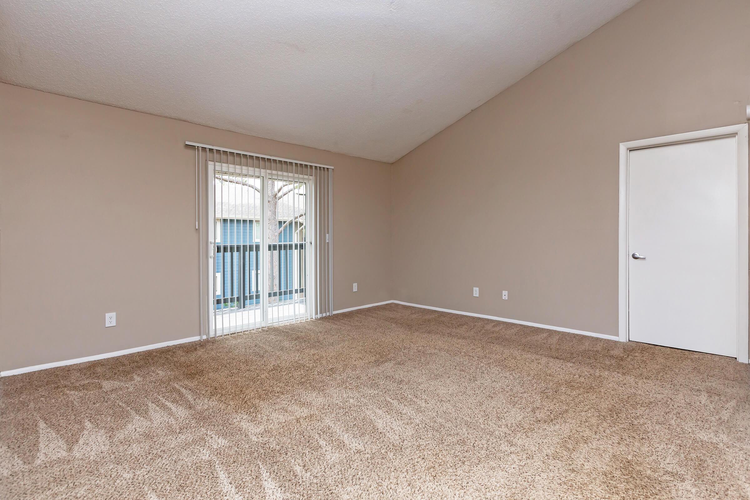 a bedroom with a bed in a room