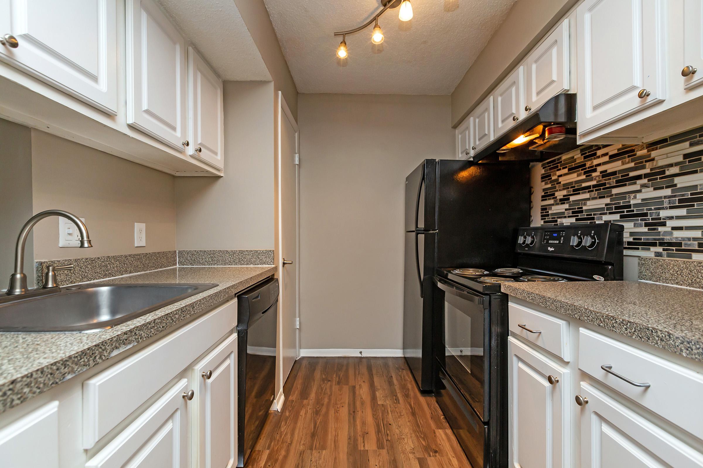 a modern kitchen with stainless steel appliances