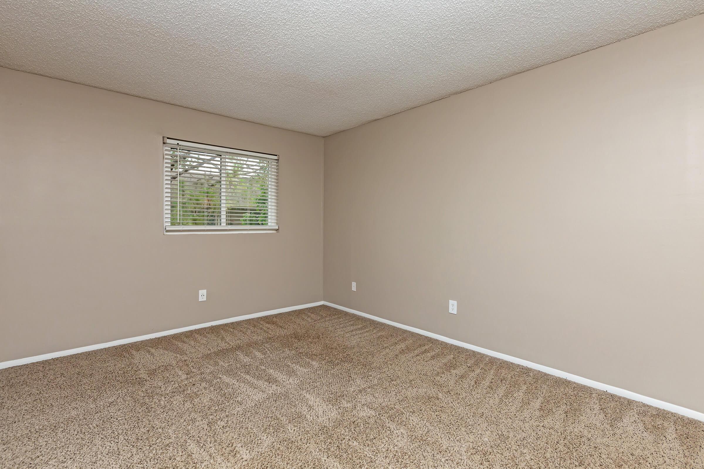 a bedroom with a large window