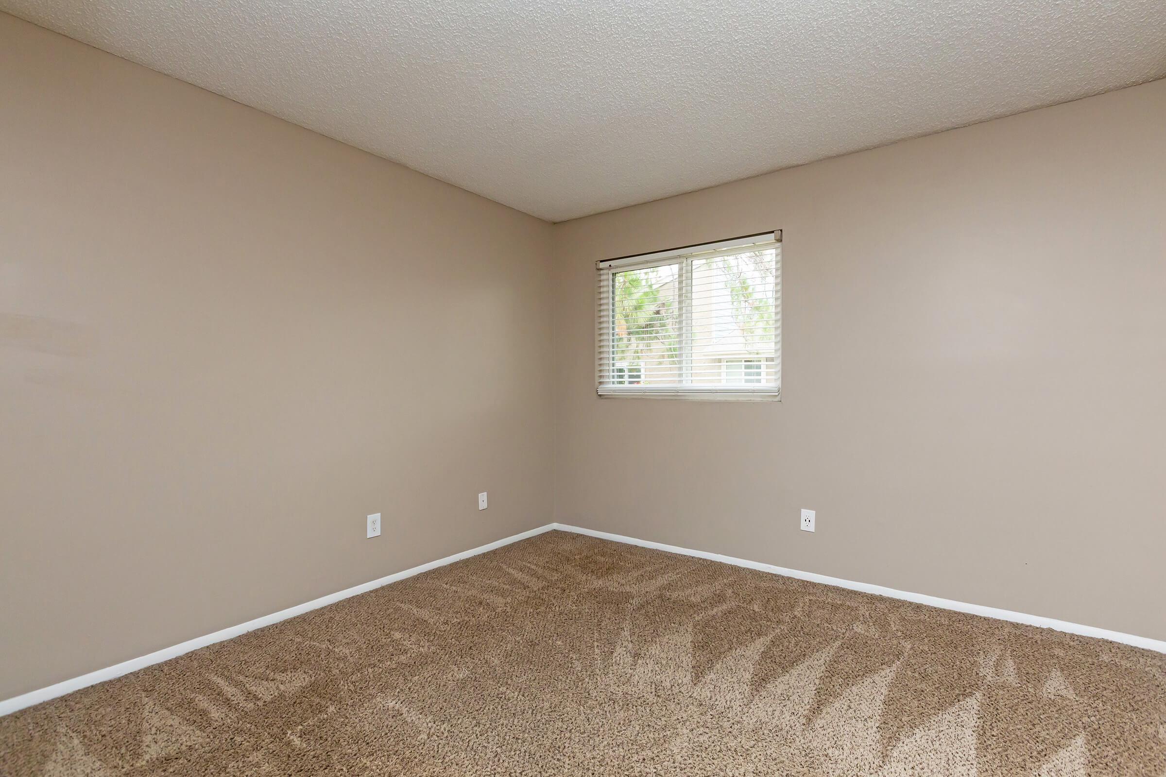 a bedroom with a large mirror