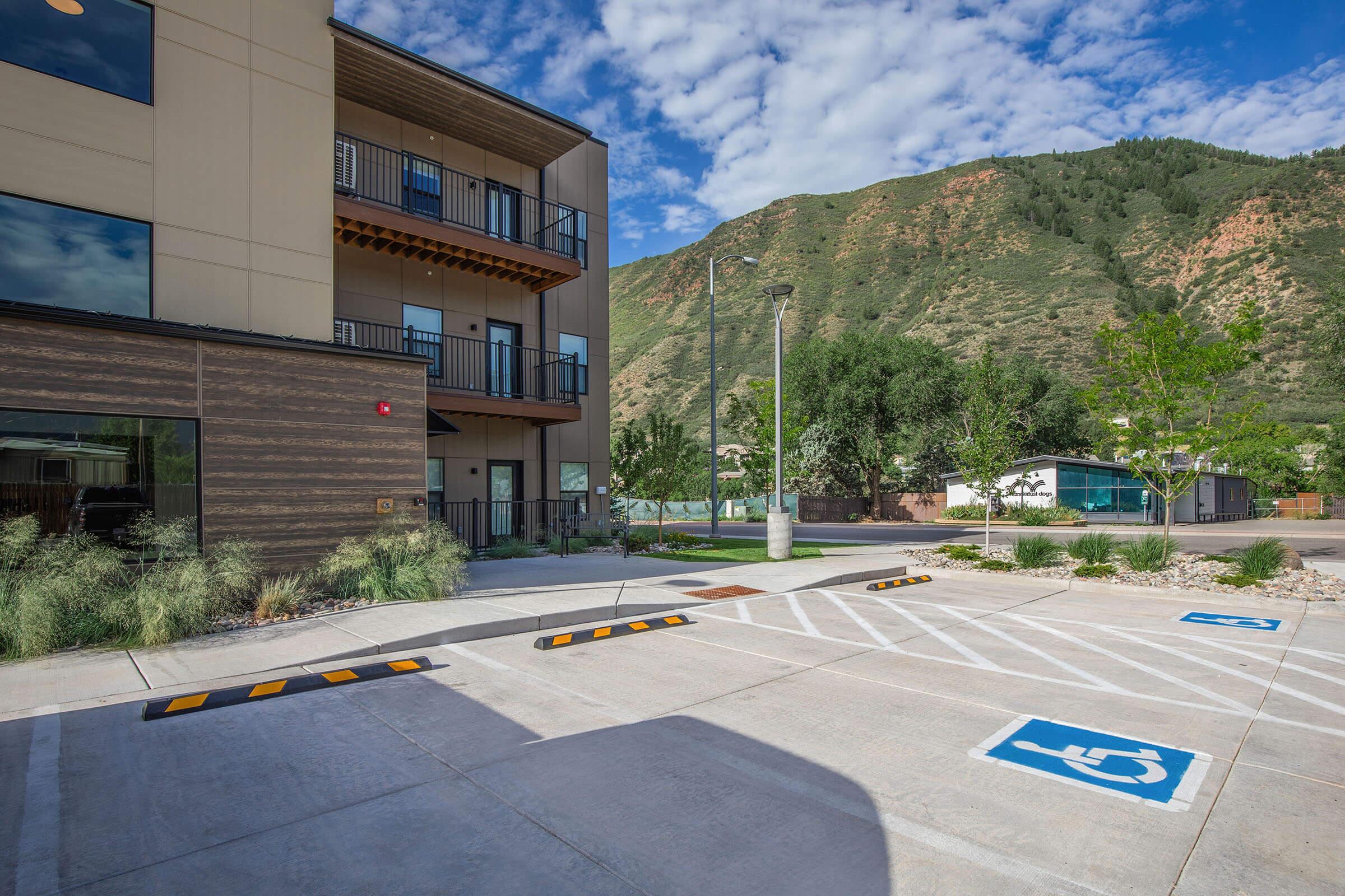 a building with a mountain in the middle of the street