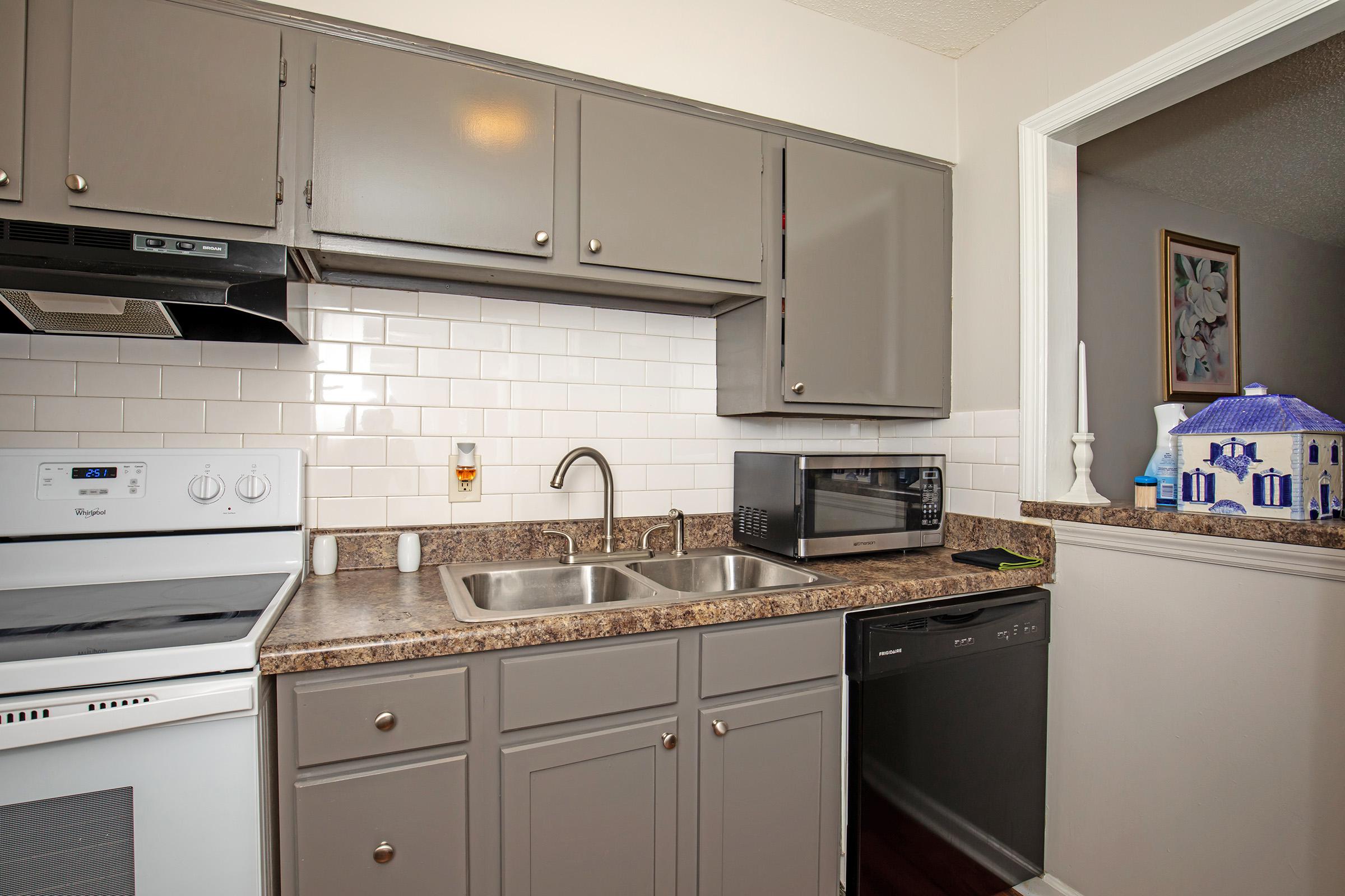 a large kitchen with stainless steel appliances