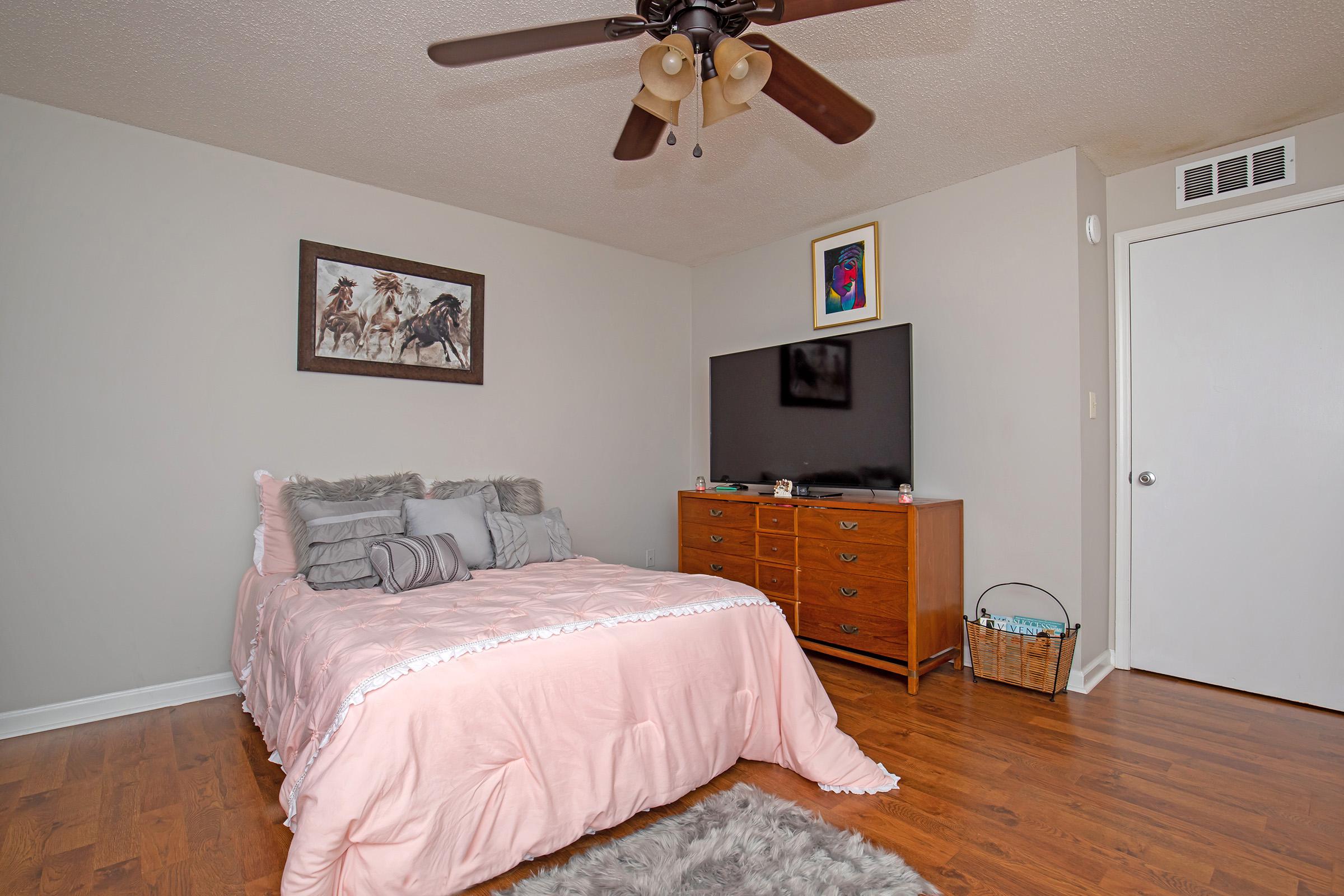 a bedroom with a large bed in a room